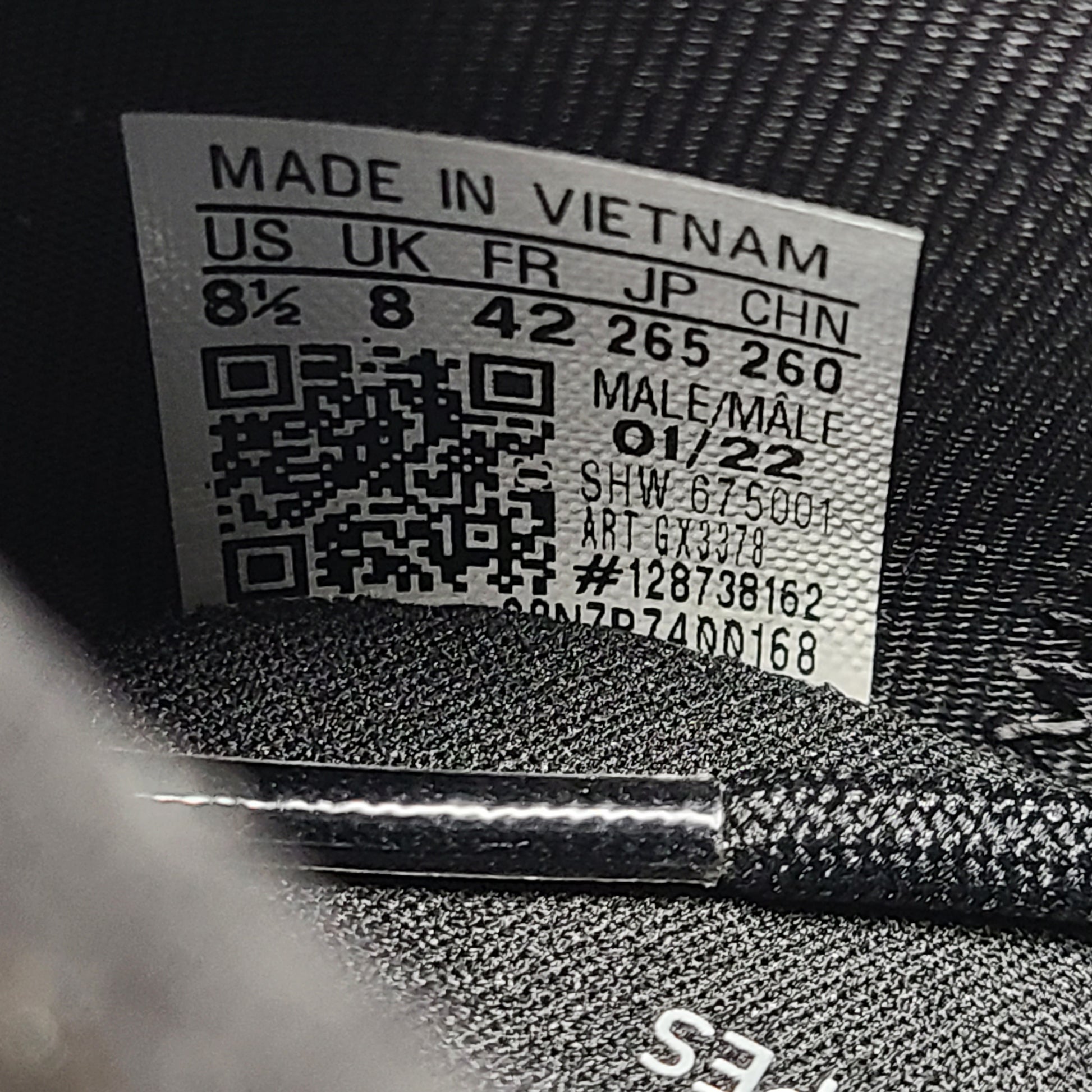 A pair of Adidas NMD_V3 Originals Shoes in black, gold, and white color scheme