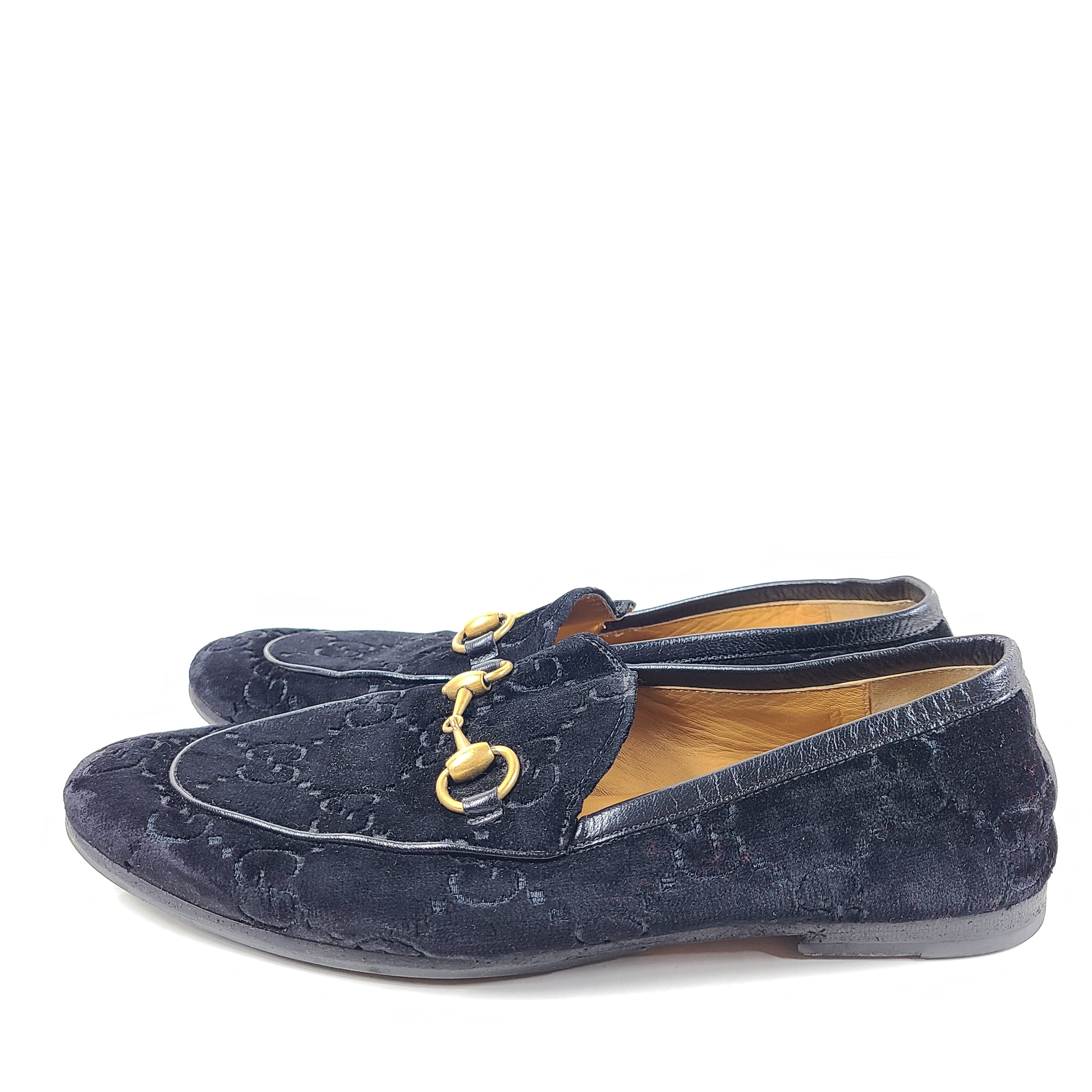 A pair of Gucci Men's Black Velvet Horsebit Loafers Size 7