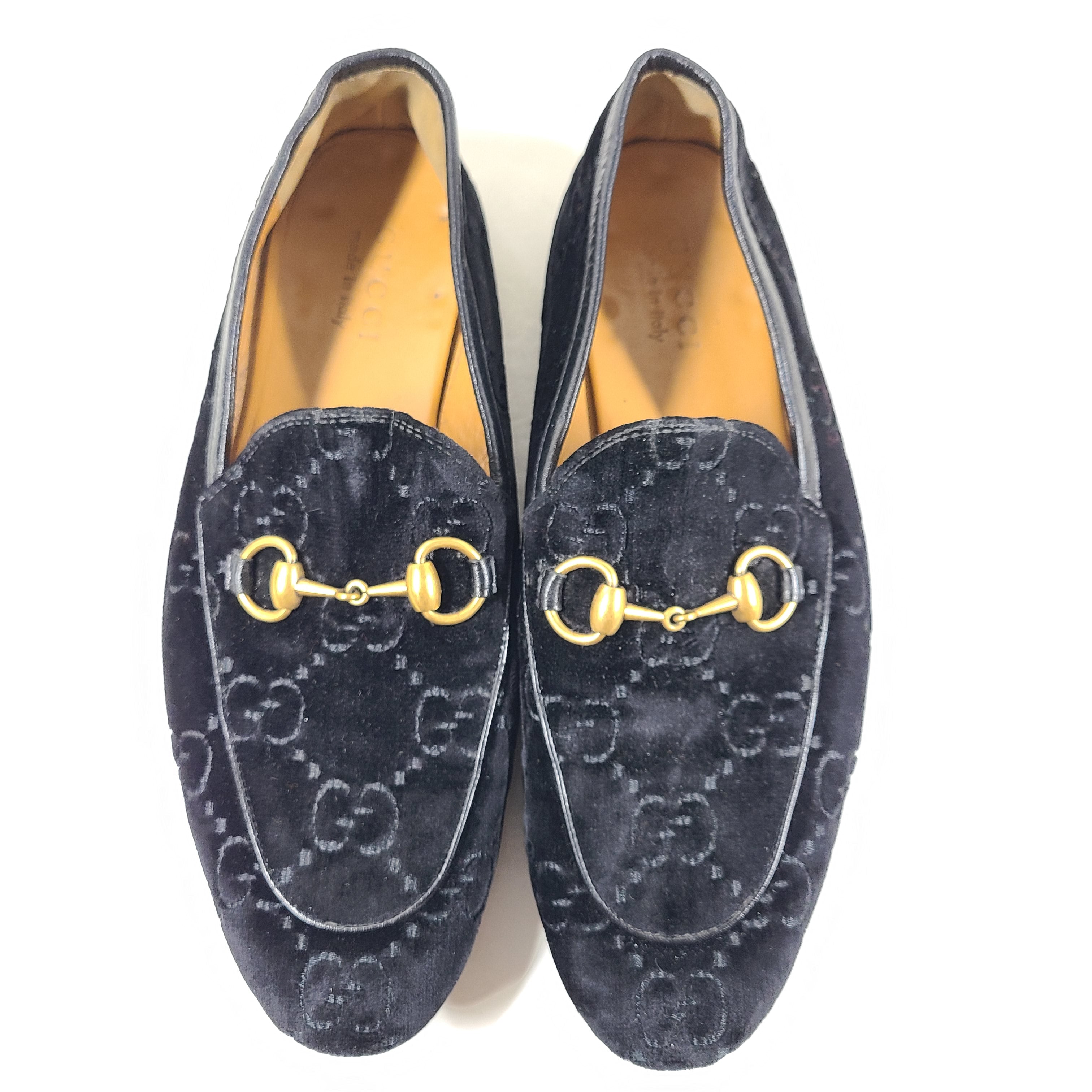 A pair of Gucci Men's Black Velvet Horsebit Loafers Size 7