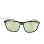 A pair of pre-owned black frame Ray-Ban sunglasses with green lenses for men