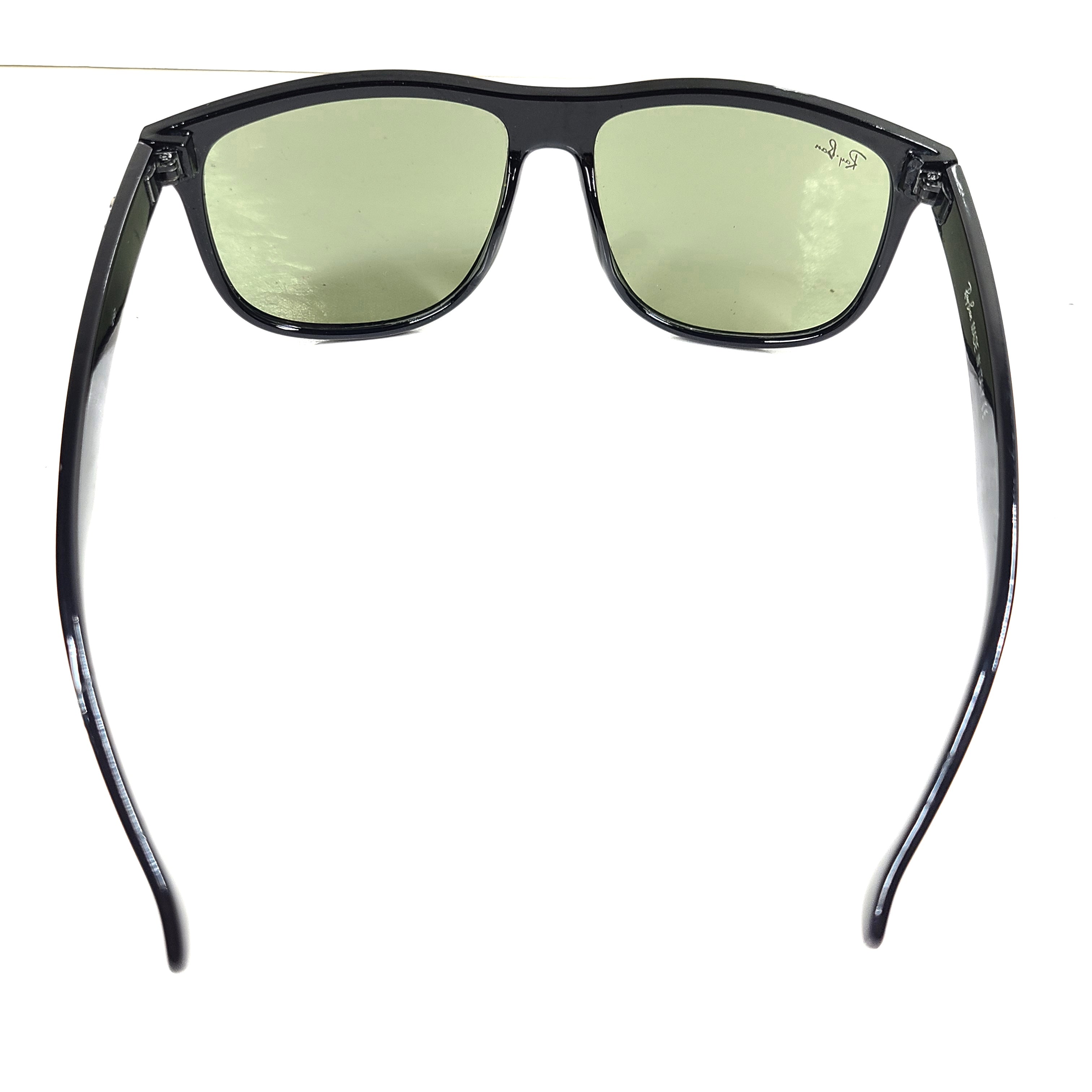 A pair of pre-owned black frame Ray-Ban sunglasses with green lenses for men