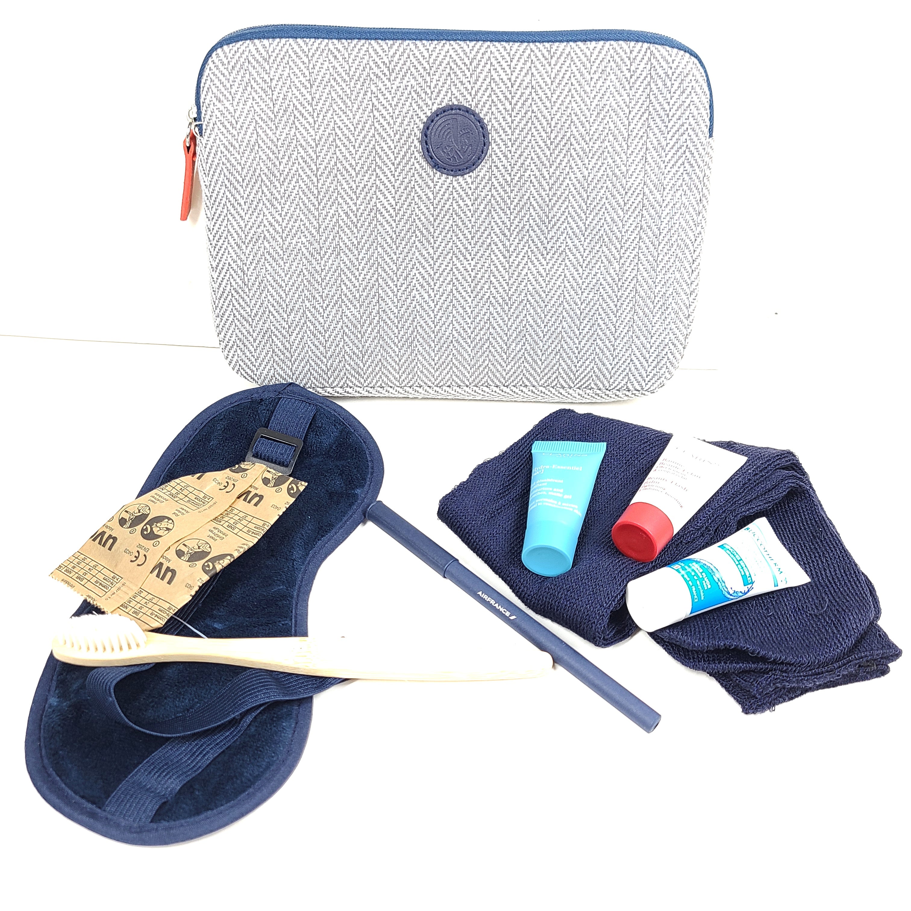 A luxurious Air France Travel Amenity Kit with Clarins skincare products