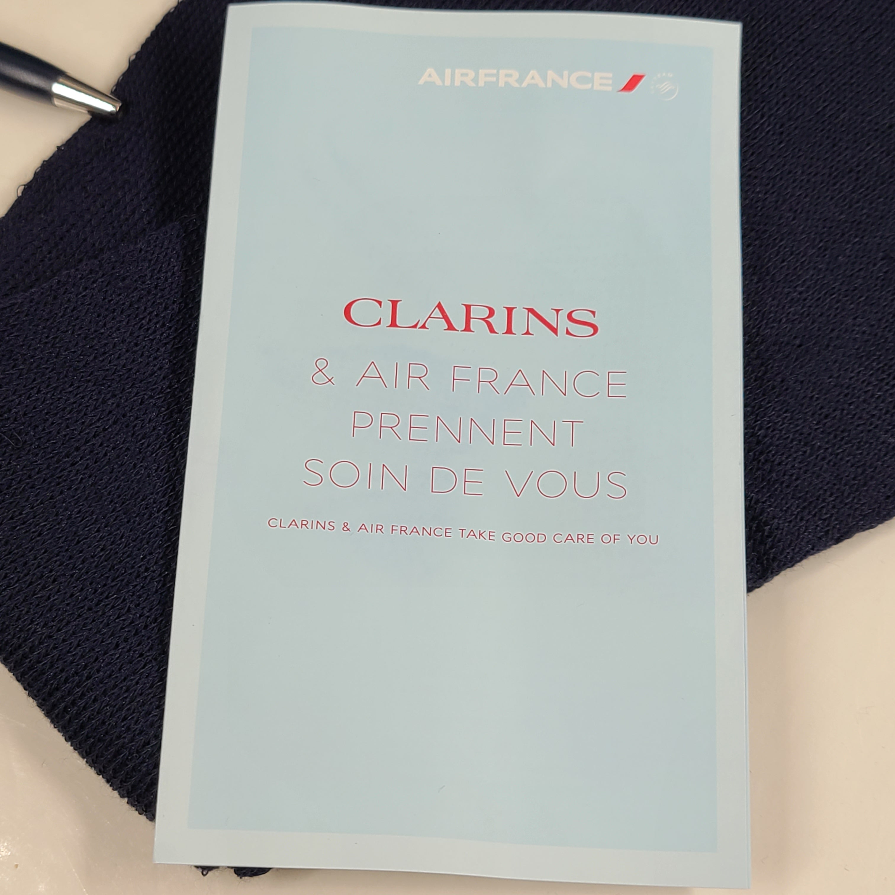 A travel kit with Clarins skincare products and Air France branding