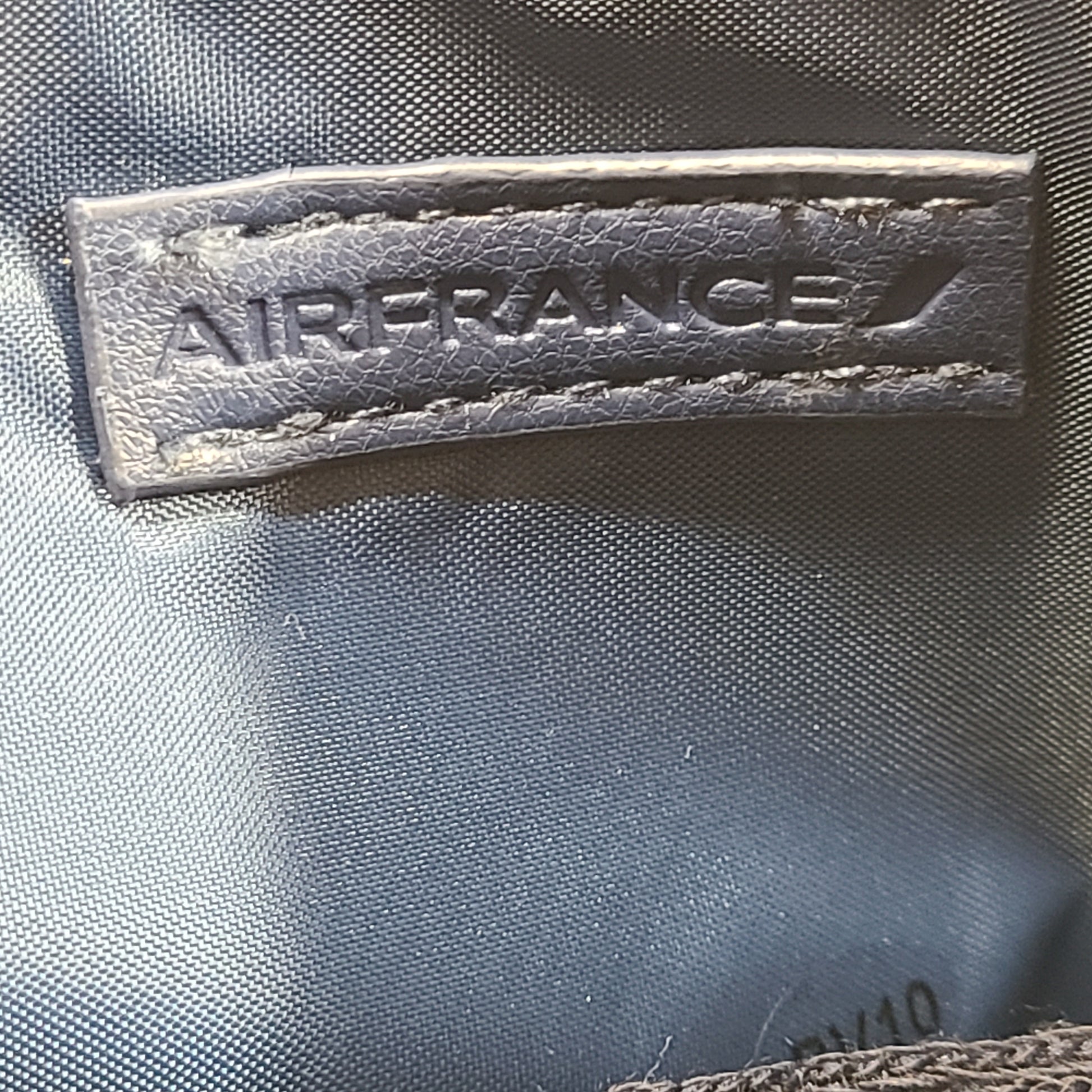 A travel kit with Clarins skincare products and Air France branding