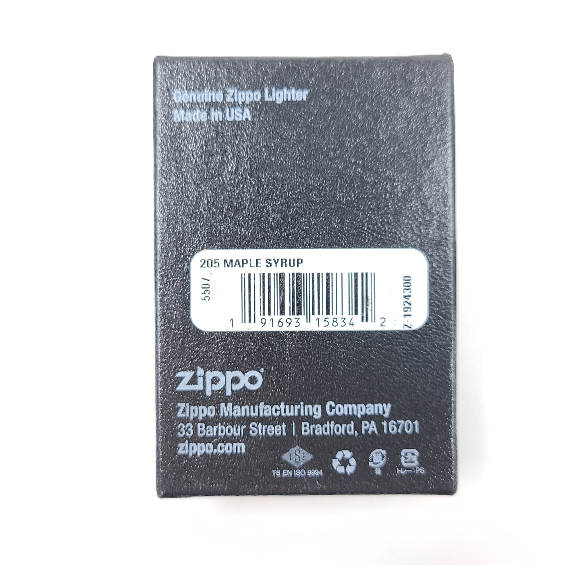 A Zippo lighter featuring a maple syrup design.