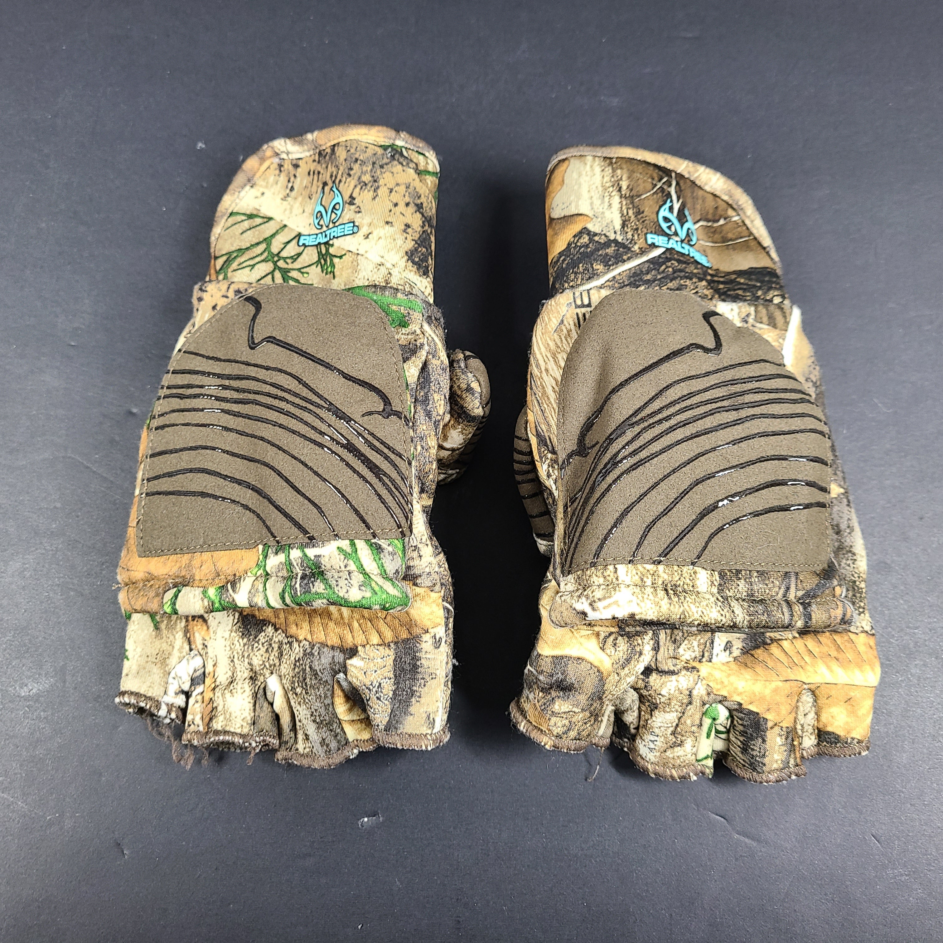 Realtree Camouflage fingerless gloves suitable for hunting and fishing activities.