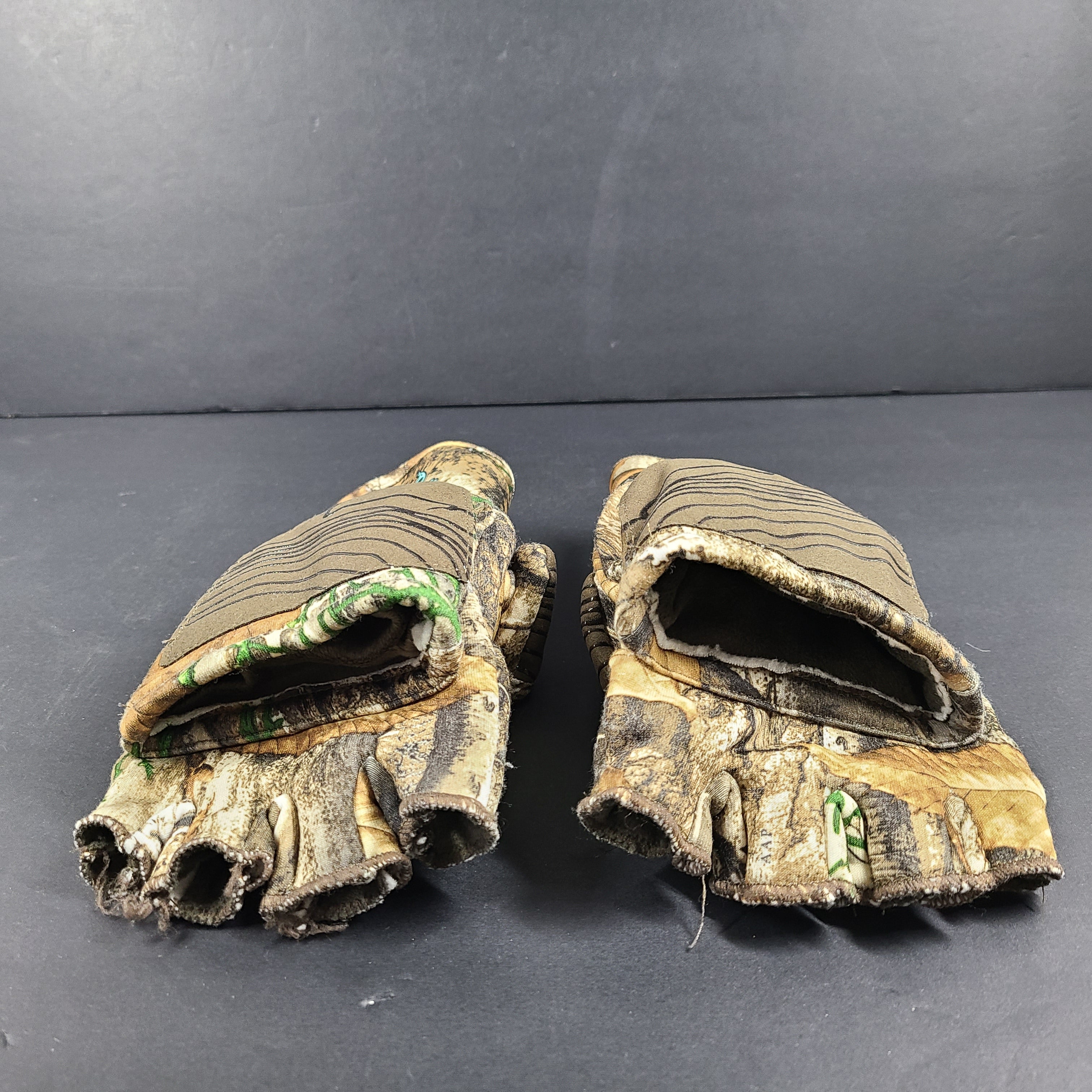 Realtree Camouflage fingerless gloves suitable for hunting and fishing activities.