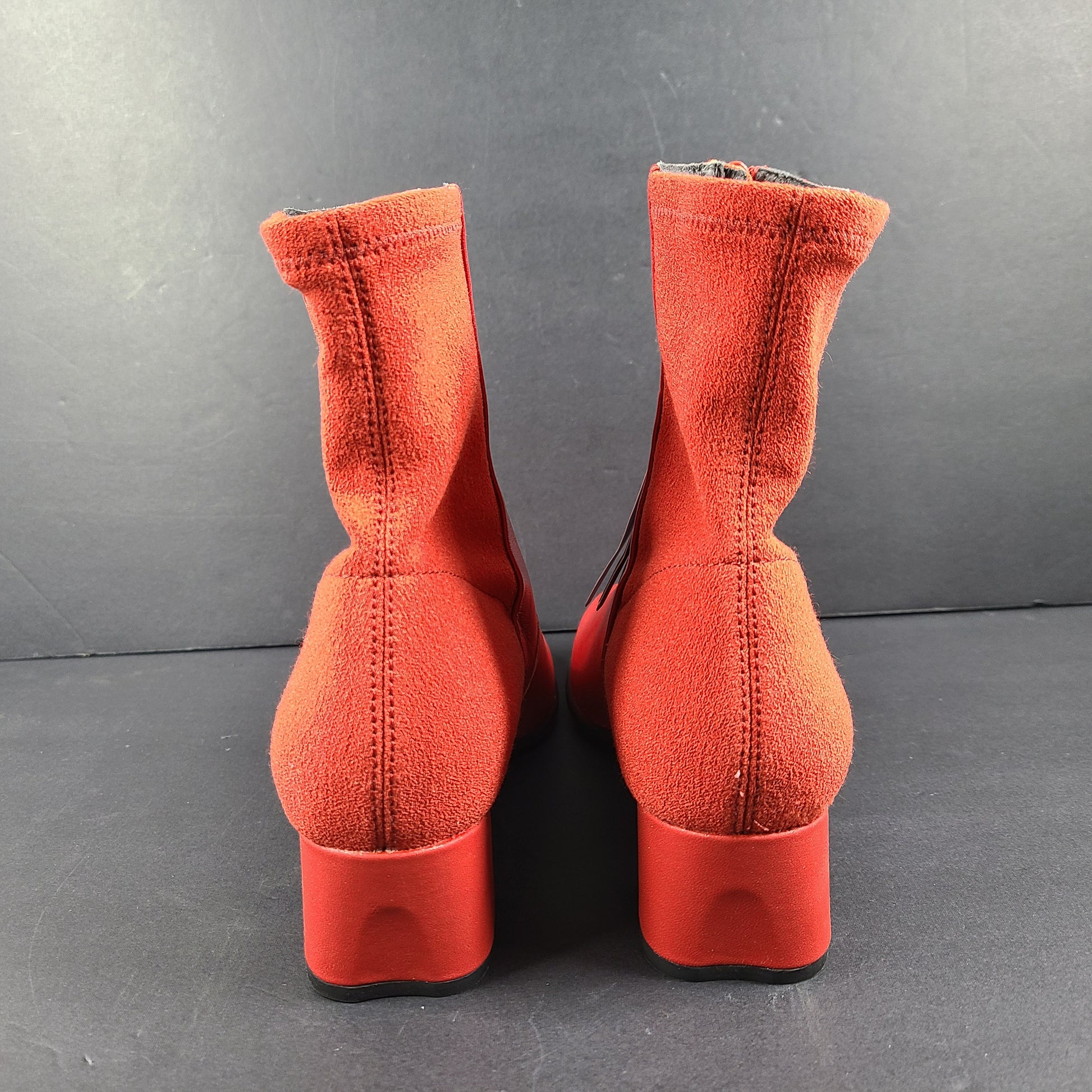 A pair of red leather ankle boots by Camper.