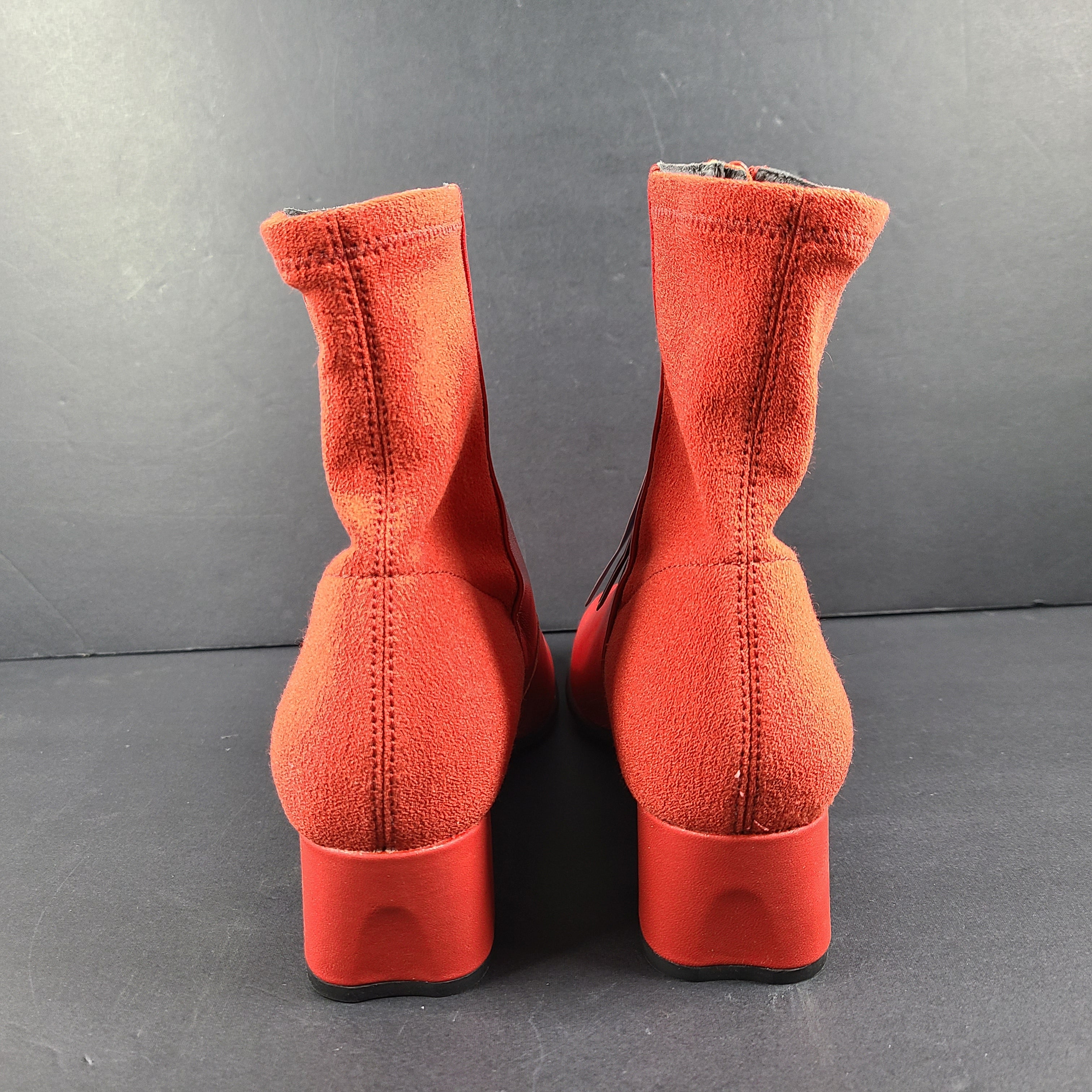 A pair of red leather ankle boots by Camper.