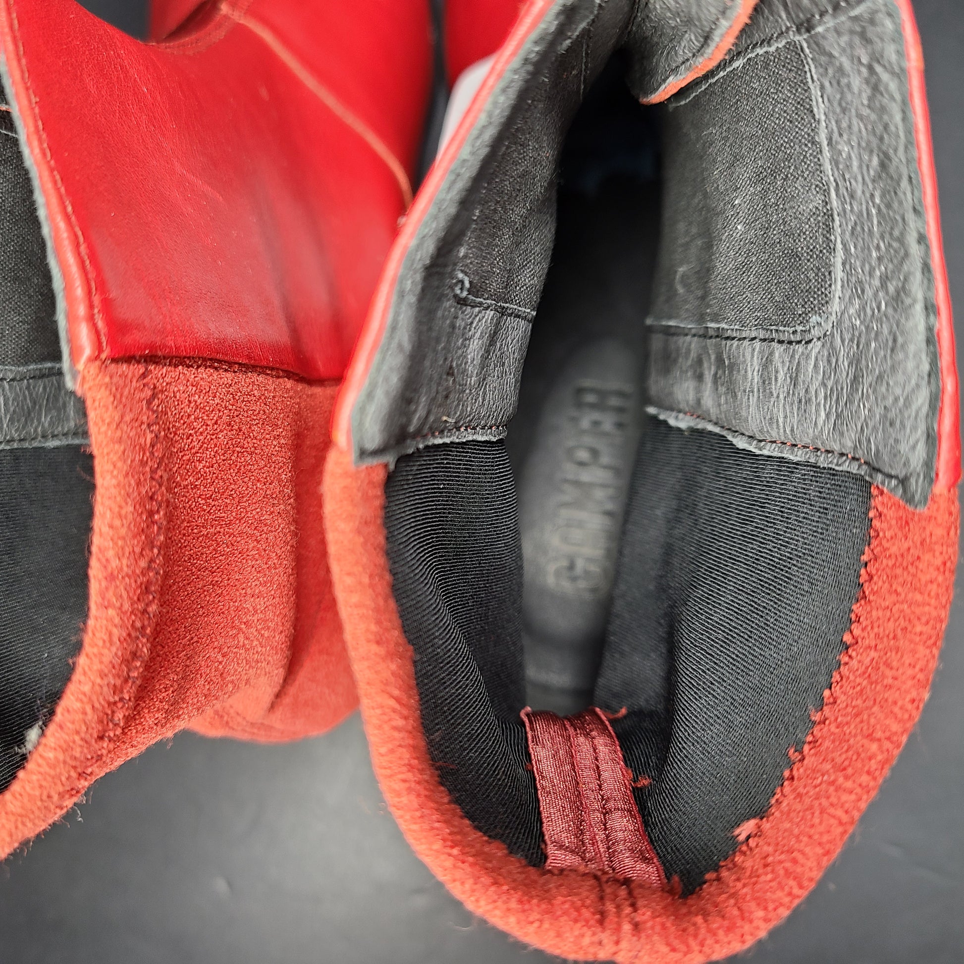A pair of red leather ankle boots by Camper.