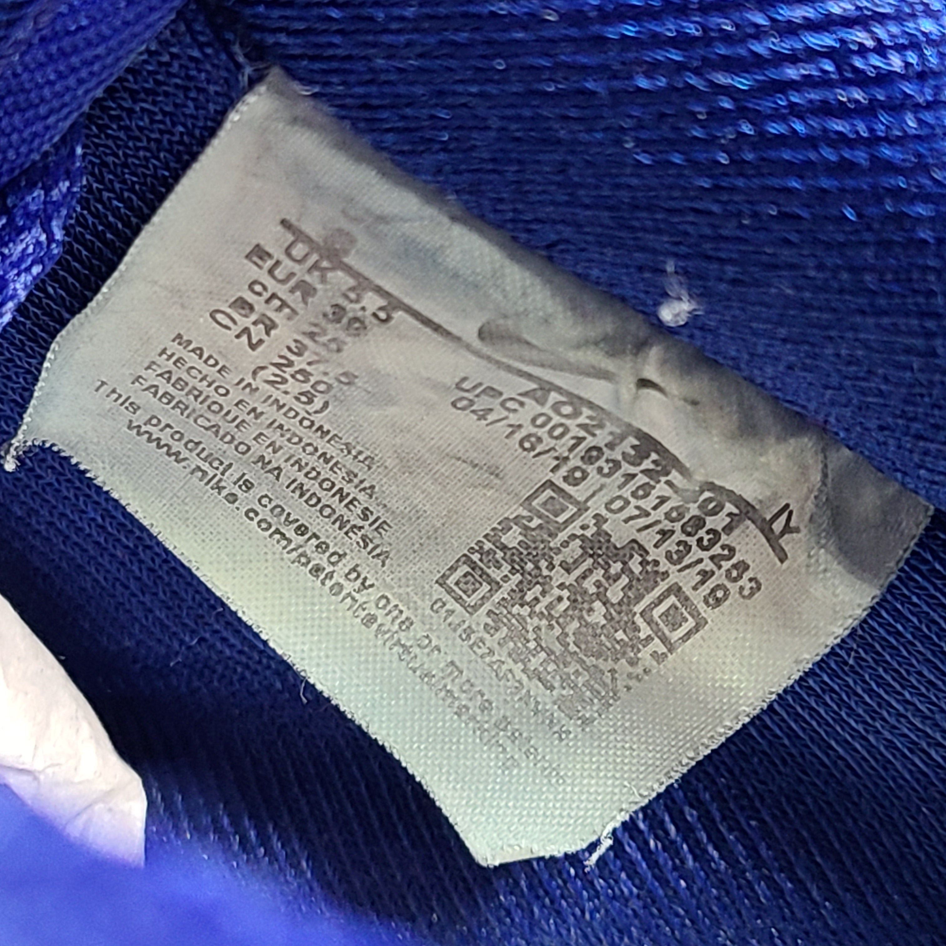 A pair of blue Nike Air Force 1 Low sneakers made of leather