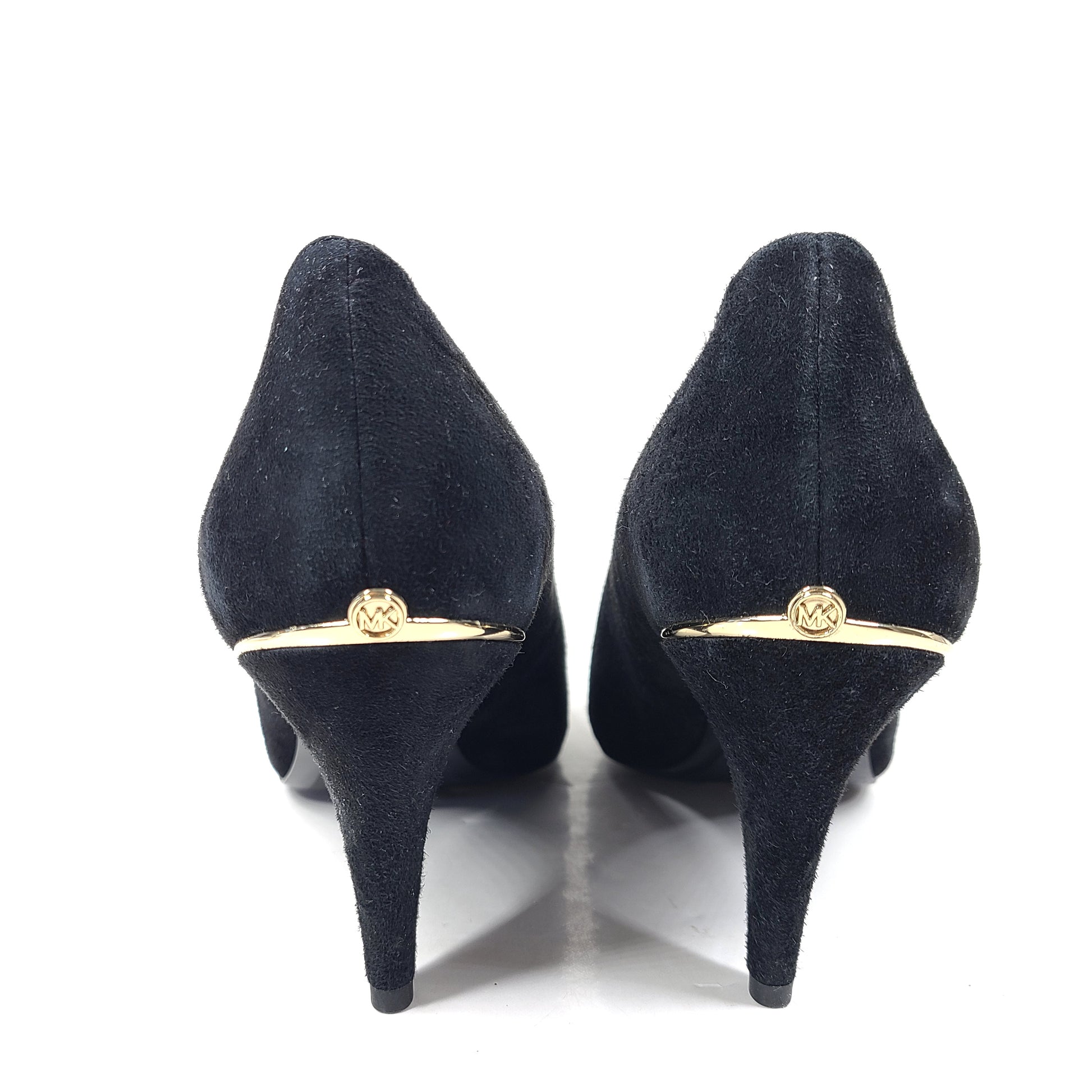 A pair of black suede Michael Kors women's heels with pointed toes, size 8.5M