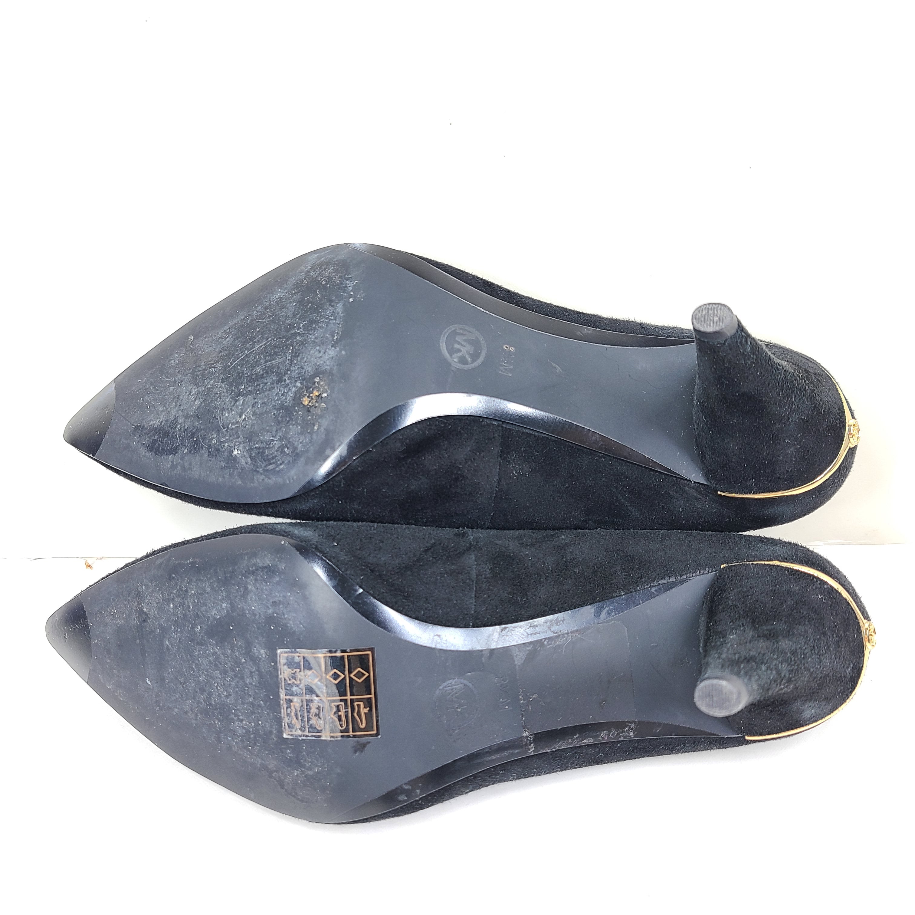 A pair of black suede Michael Kors women's heels with pointed toes, size 8.5M