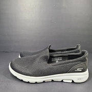 A pair of comfortable Skechers Go Walk 5 Slip-On Shoes in black, size 9.