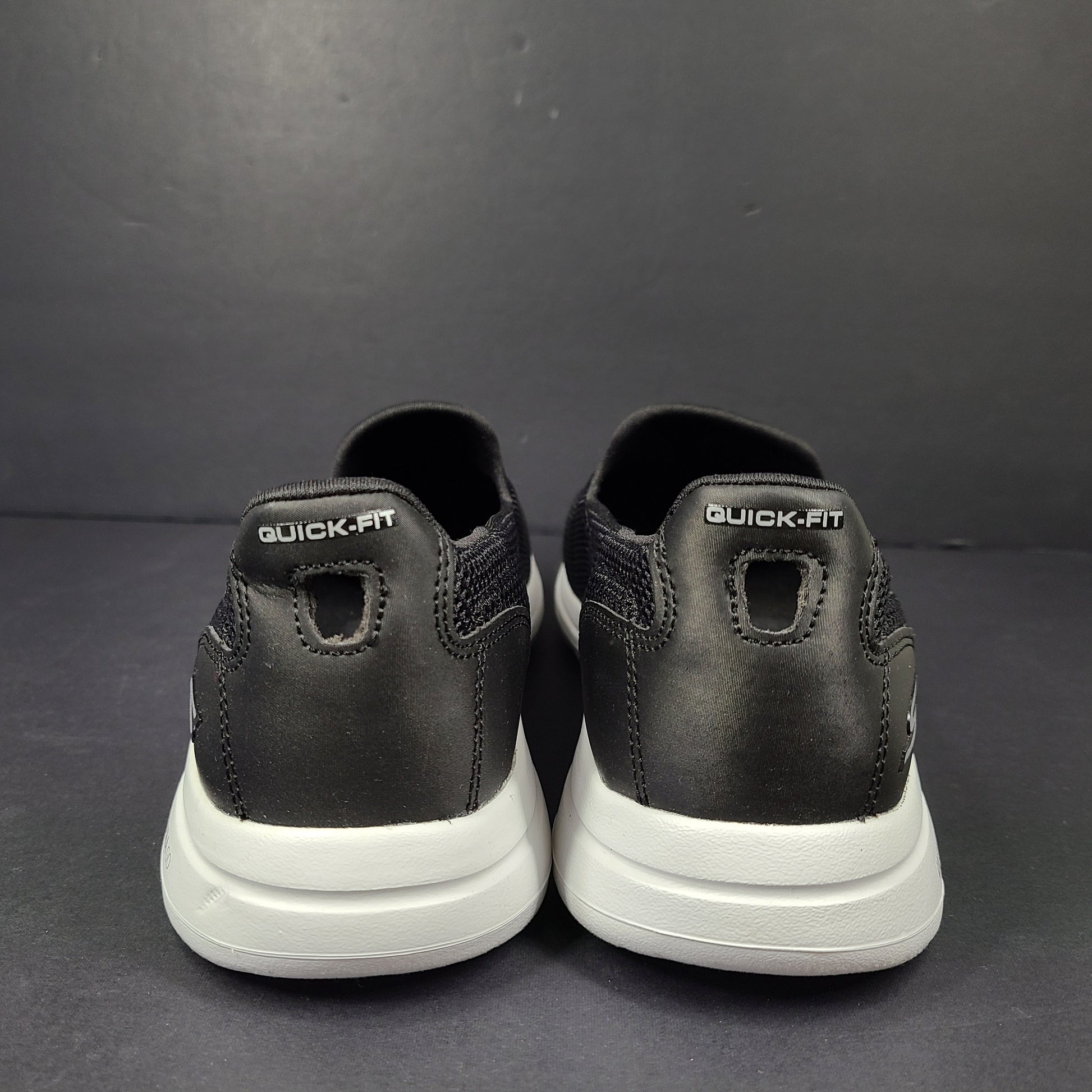 A pair of comfortable Skechers Go Walk 5 Slip-On Shoes in black, size 9.