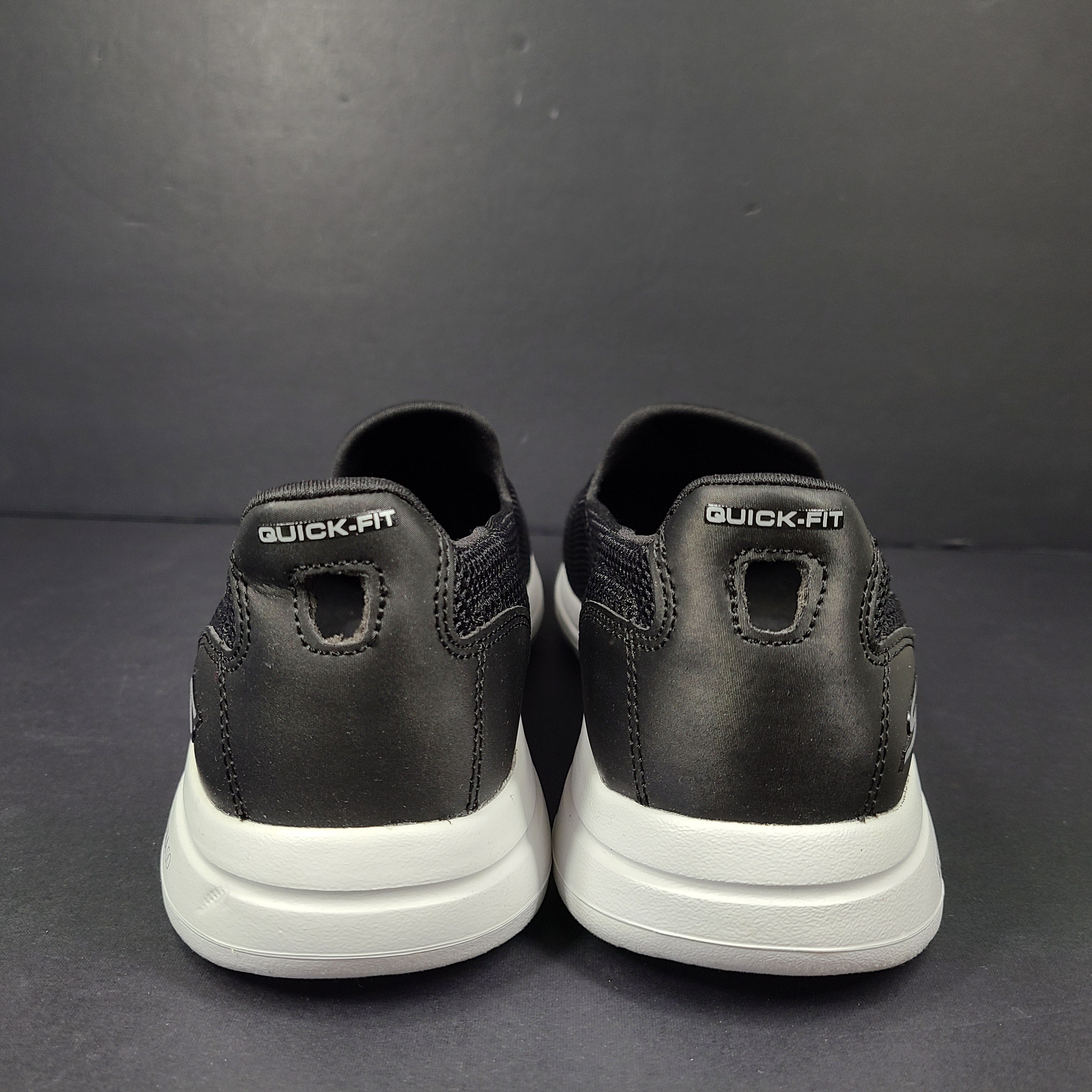 A pair of comfortable Skechers Go Walk 5 Slip-On Shoes in black, size 9.