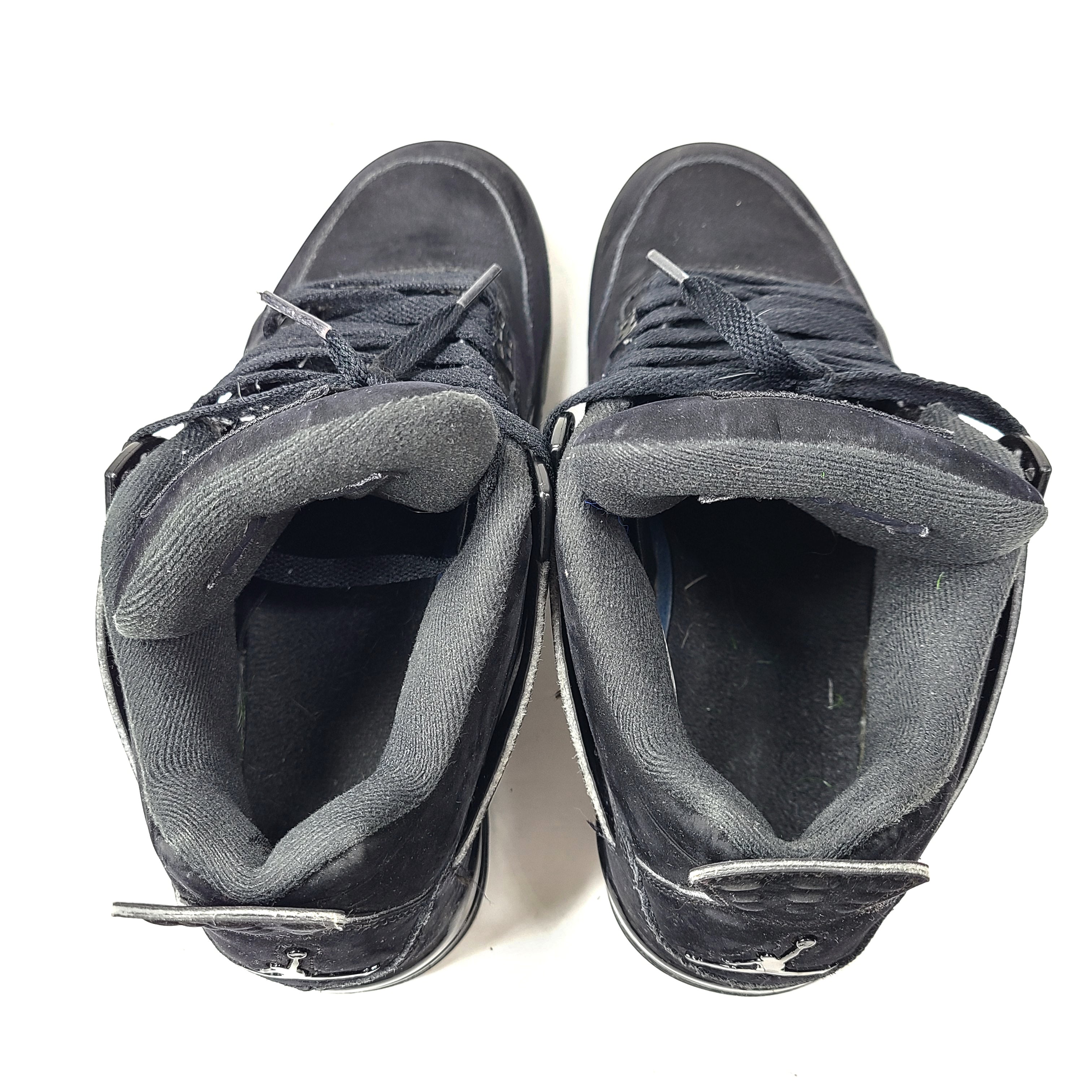 A pair of Nike Air Jordan 4 IV Retro Black Cat CU1110-010 Men's Shoes in black color