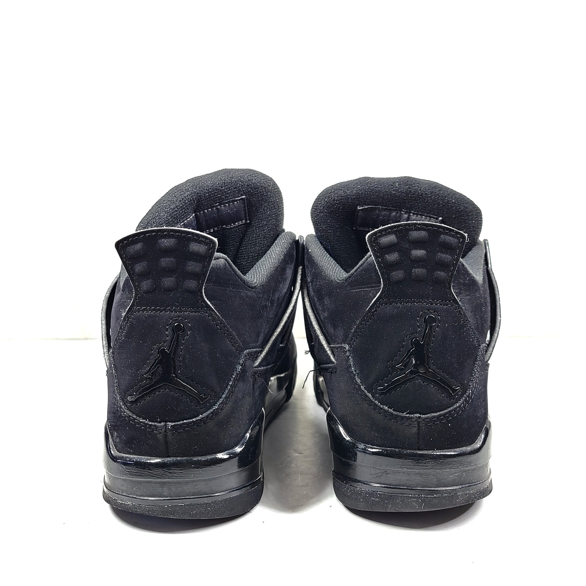 A pair of Nike Air Jordan 4 IV Retro Black Cat CU1110-010 Men's Shoes in black color