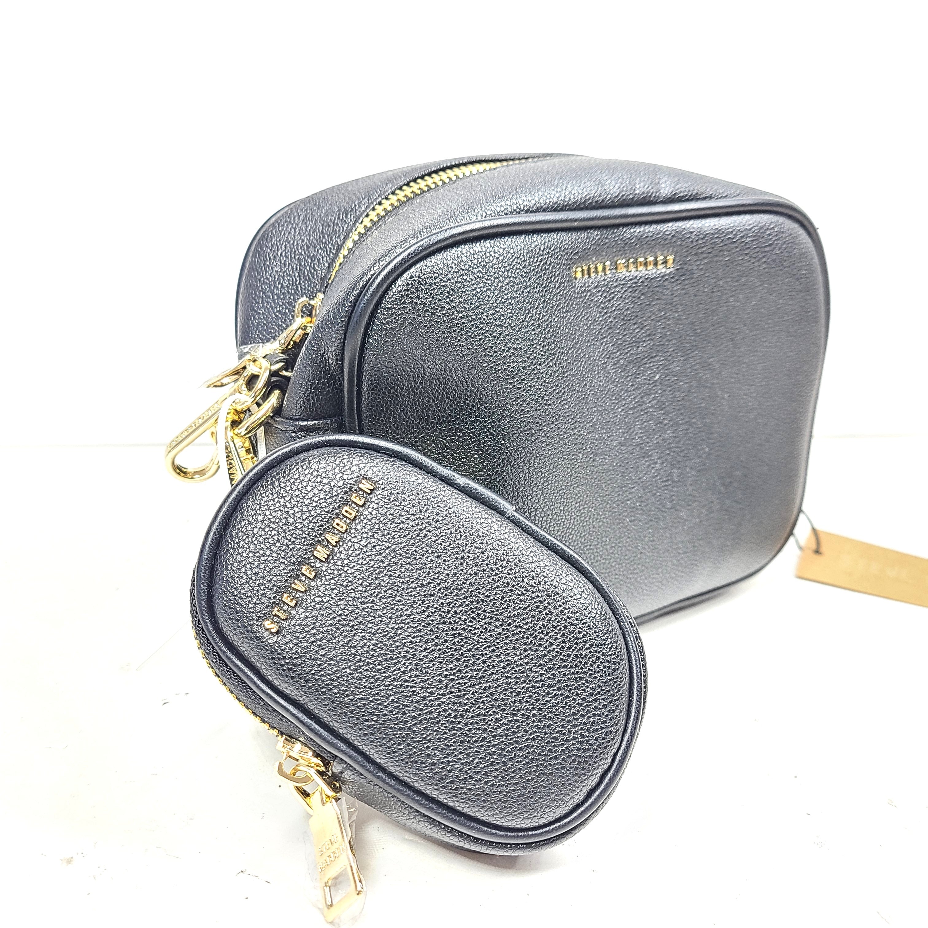 A stylish black crossbody bag with a detachable pouch and gold chain strap.