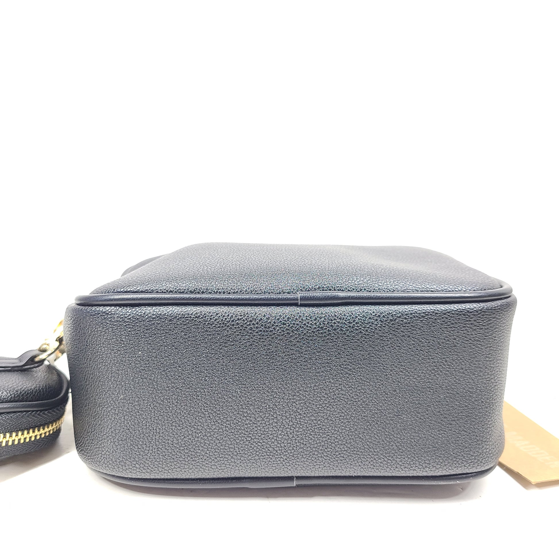 A stylish black crossbody bag with a detachable pouch and gold chain strap.
