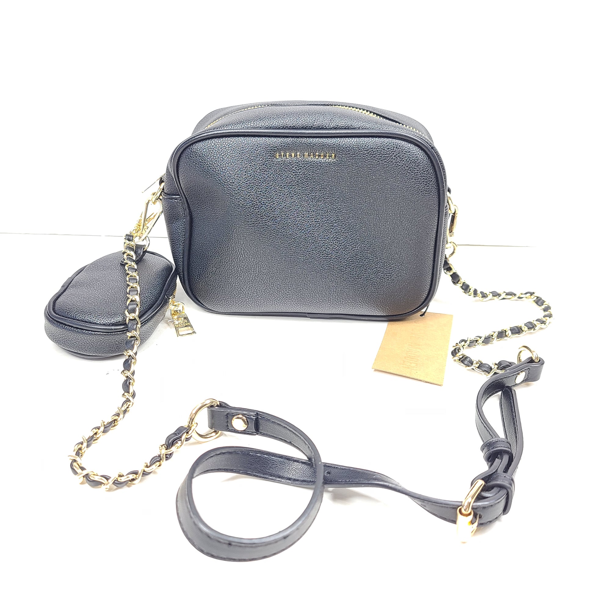 A stylish black crossbody bag with a detachable pouch and gold chain strap.