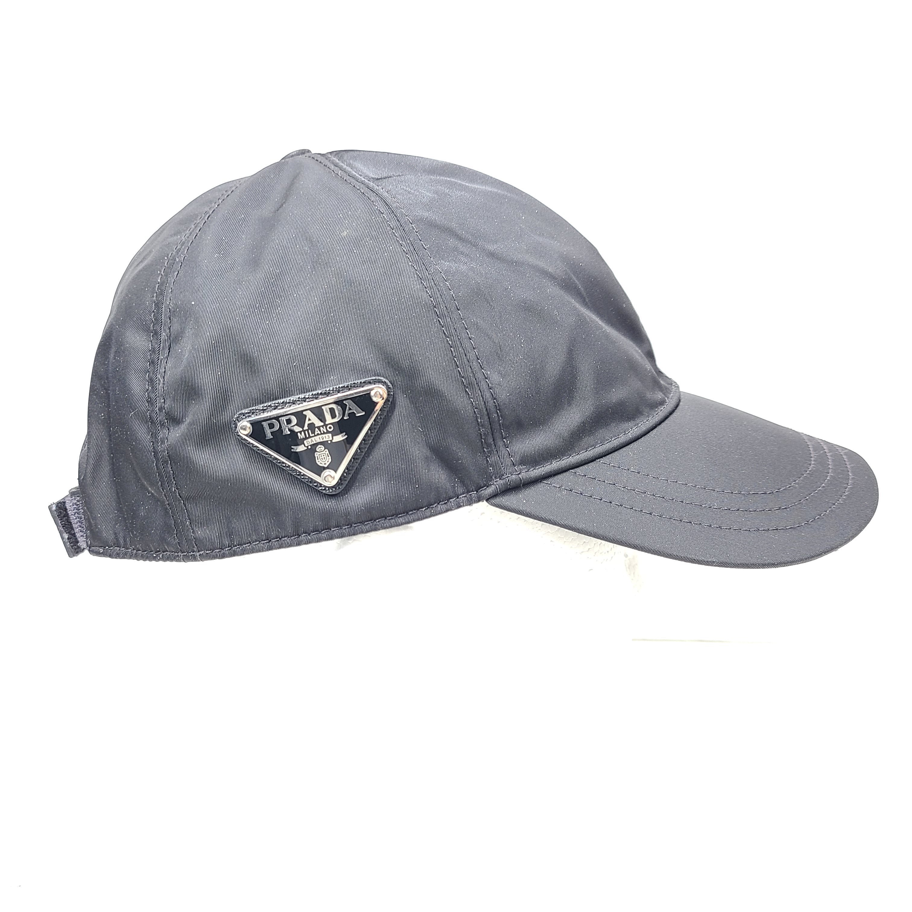 A stylish gray Prada Re-Nylon cap for men.