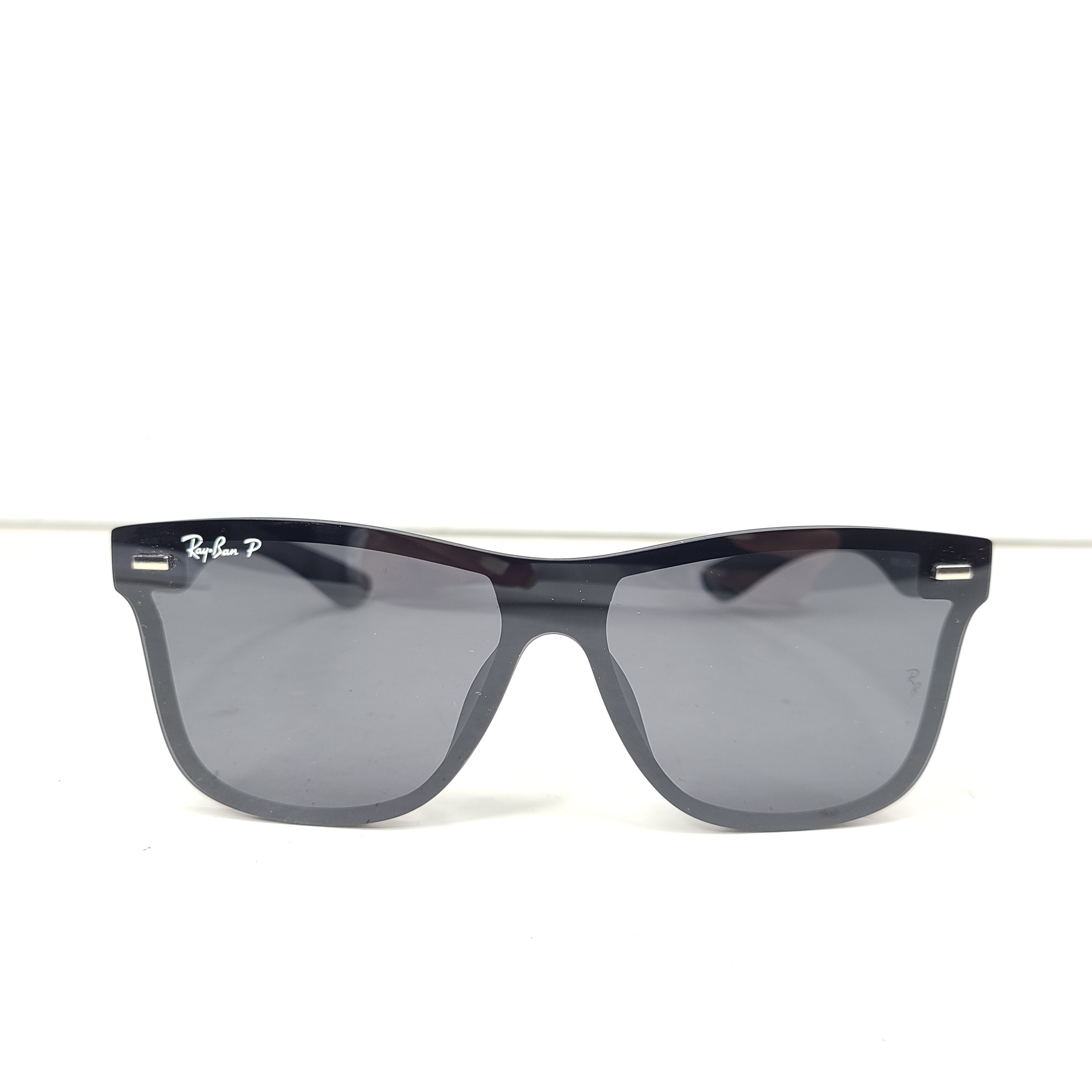 A pair of black polarized Ray-Ban RB650 sunglasses for men.