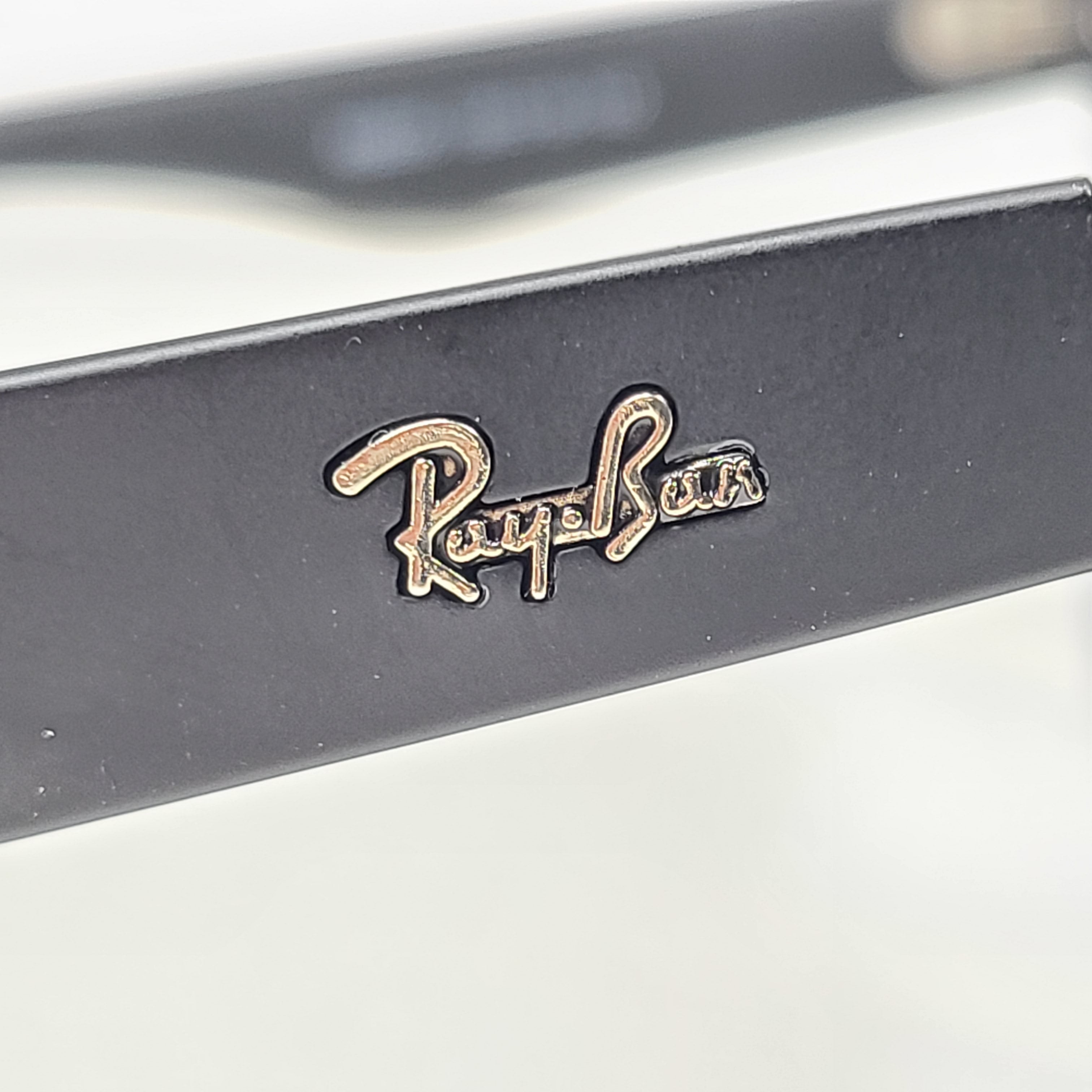 A pair of black polarized Ray-Ban RB650 sunglasses for men.