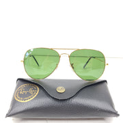 Classic Ray-Ban RB3026 Aviator Sunglasses in green lens and gold frame for men.