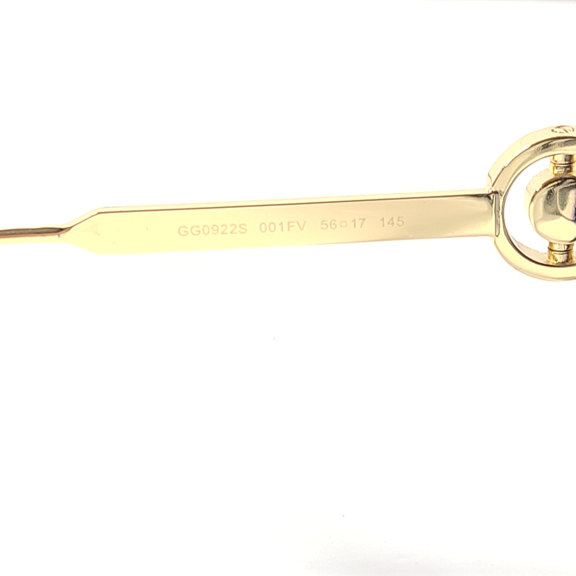 A stylish pair of Gucci women's sunglasses in black and gold gradient.