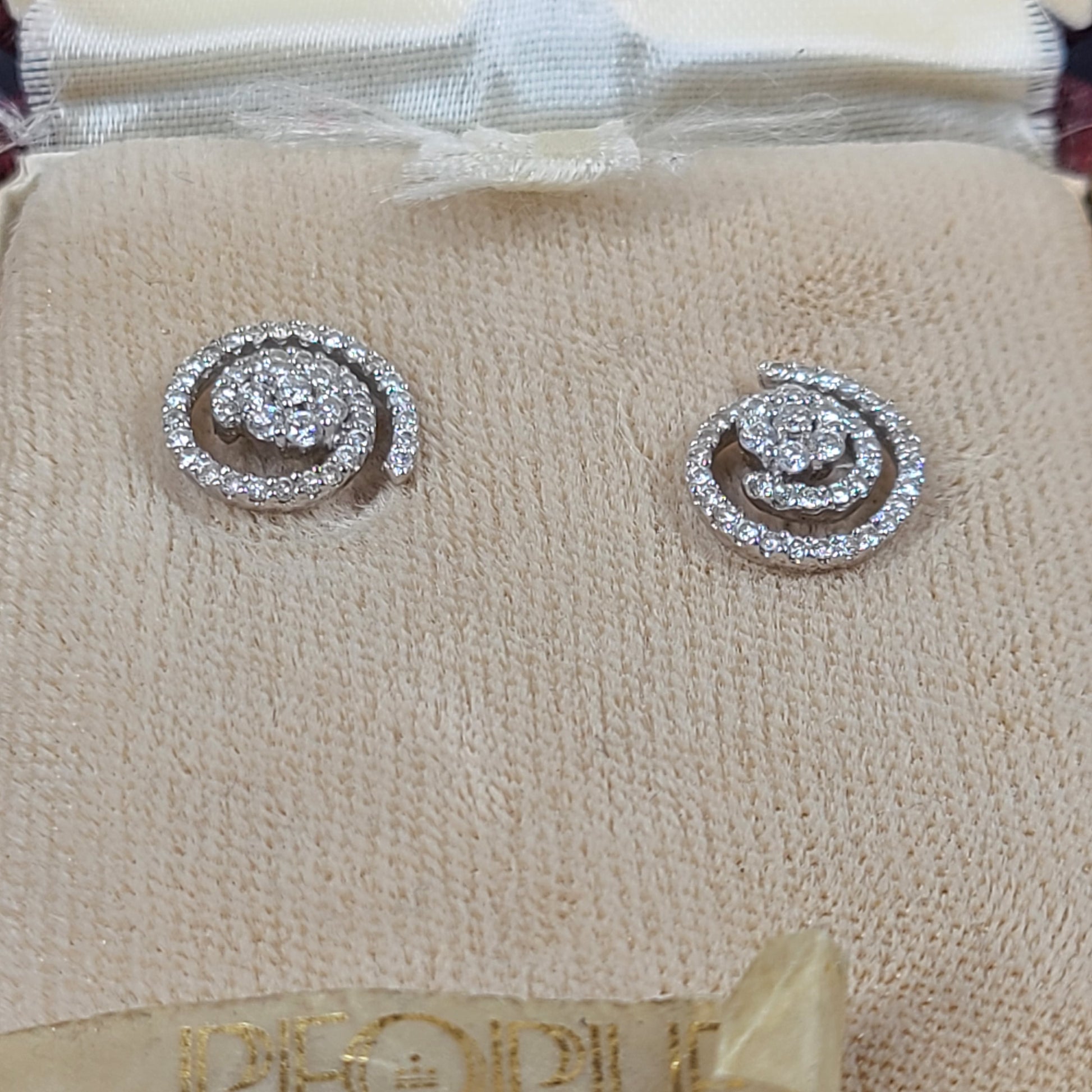 Pair of diamond swirl stud earrings in original box