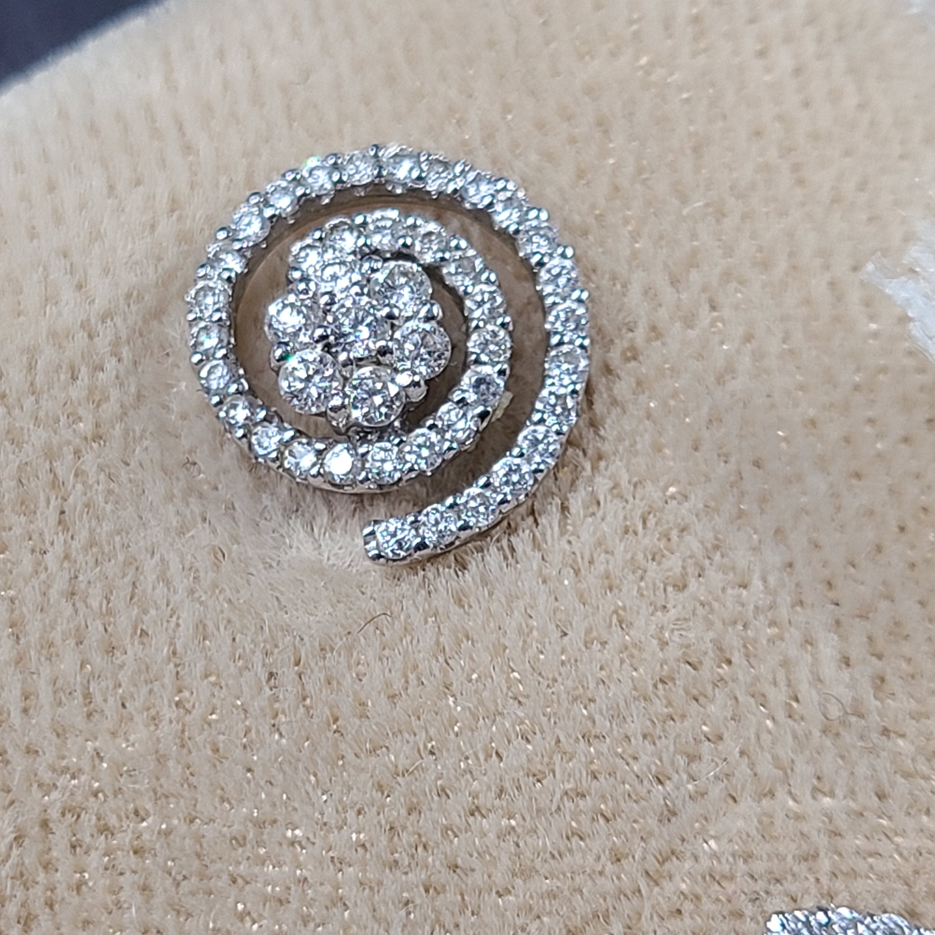 Pair of diamond swirl stud earrings in original box