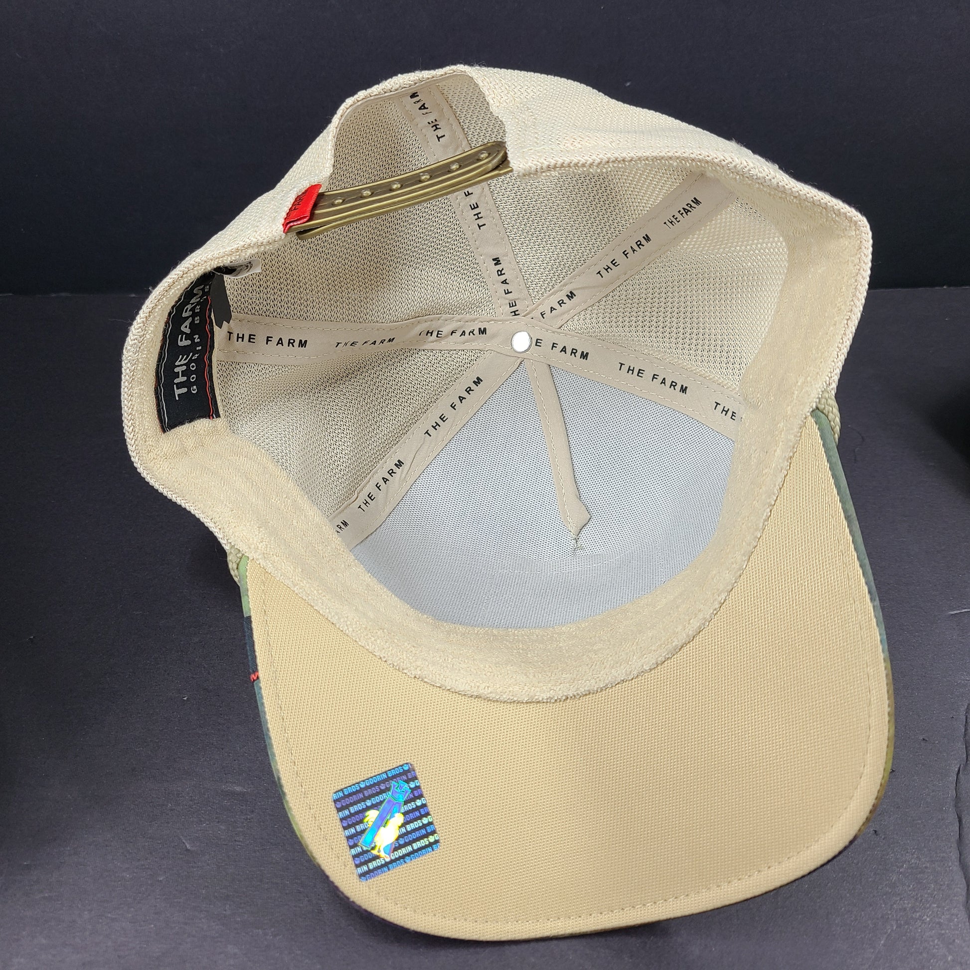 A stylish Goorin Bros The Farm Cocky Rooster Trucker Hat for men.