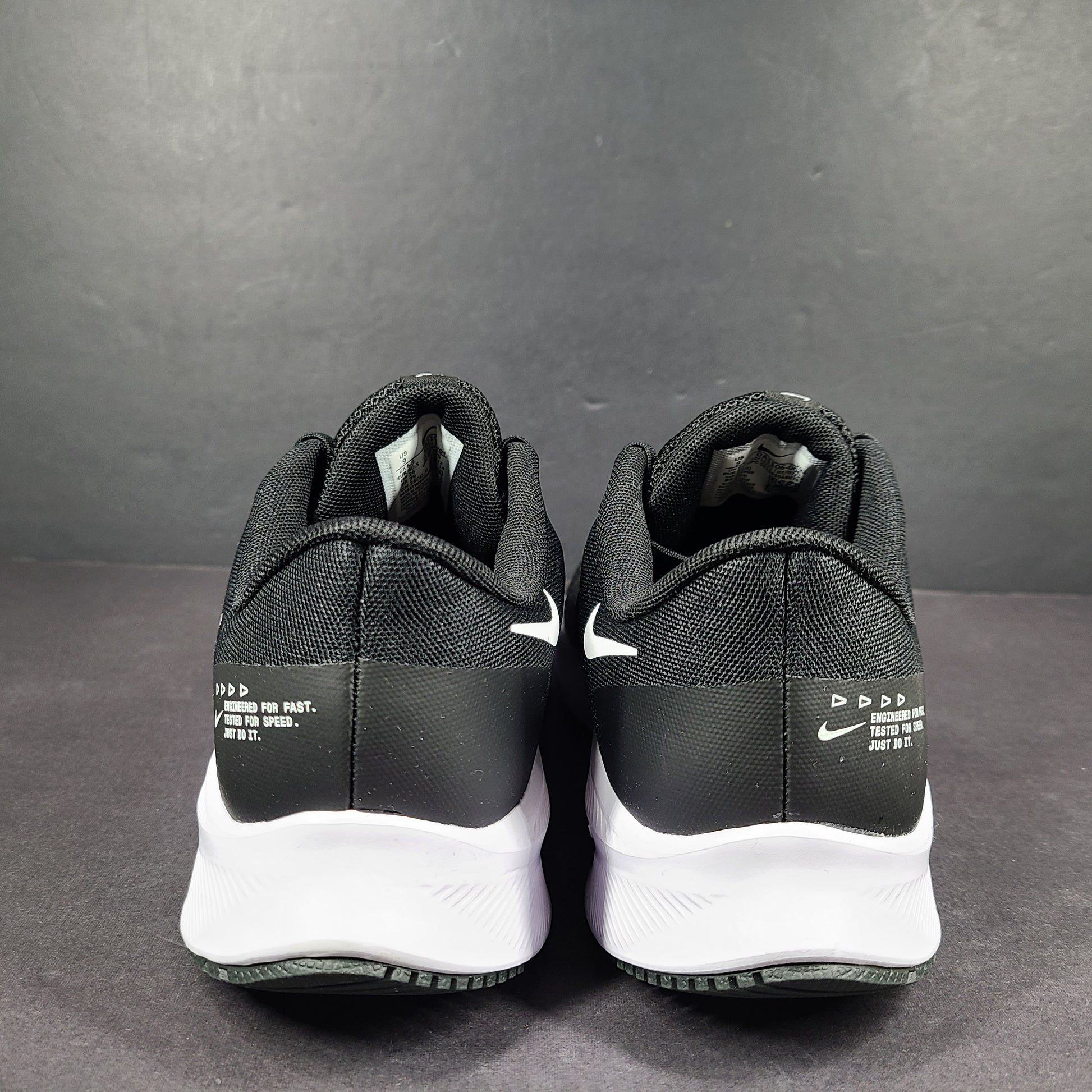 Sleek black Nike Quest 4 running shoes deliver lightweight cushioning and a streamlined fit for daily road runs.