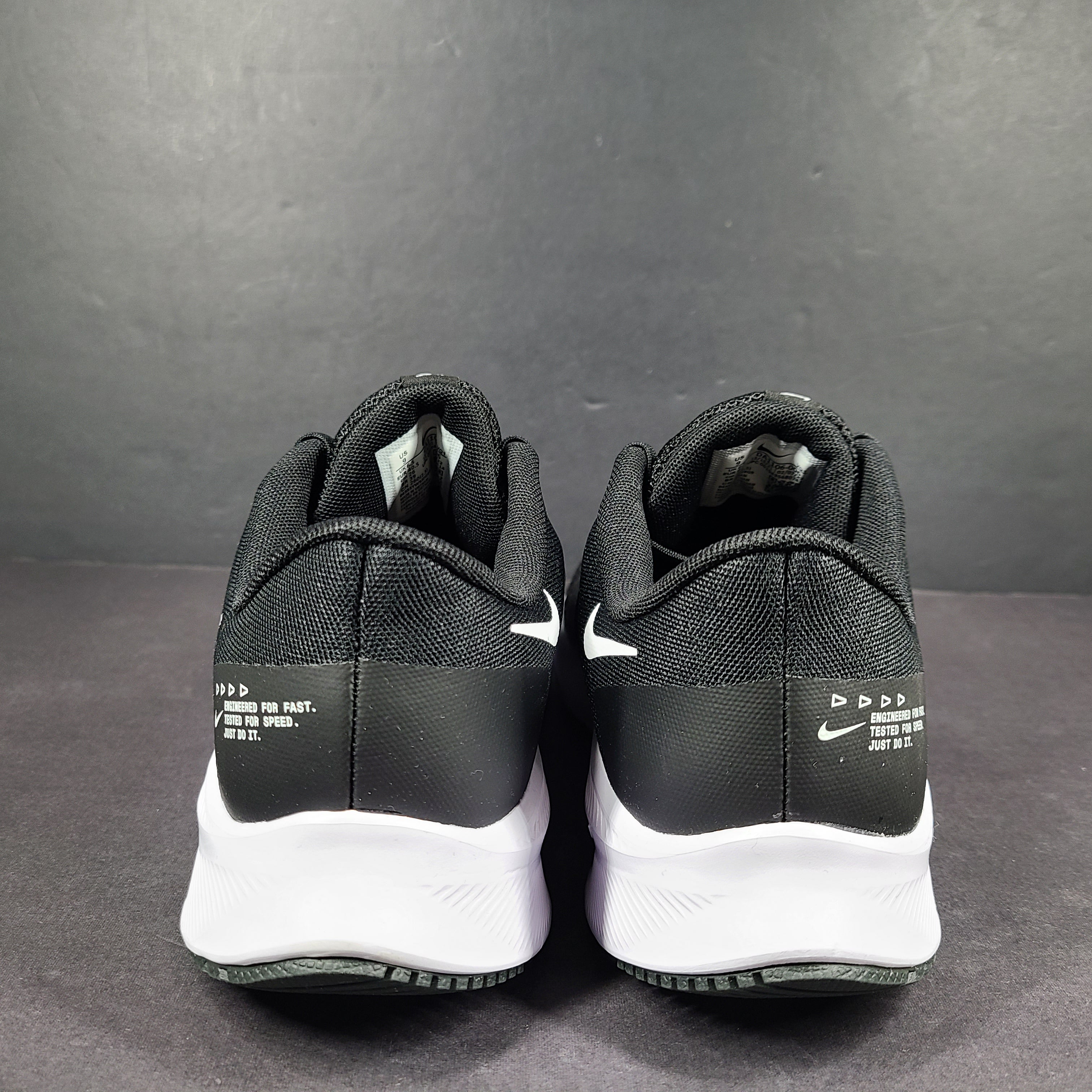 Sleek black Nike Quest 4 running shoes deliver lightweight cushioning and a streamlined fit for daily road runs.