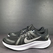 Sleek black Nike Quest 4 running shoes deliver lightweight cushioning and a streamlined fit for daily road runs.