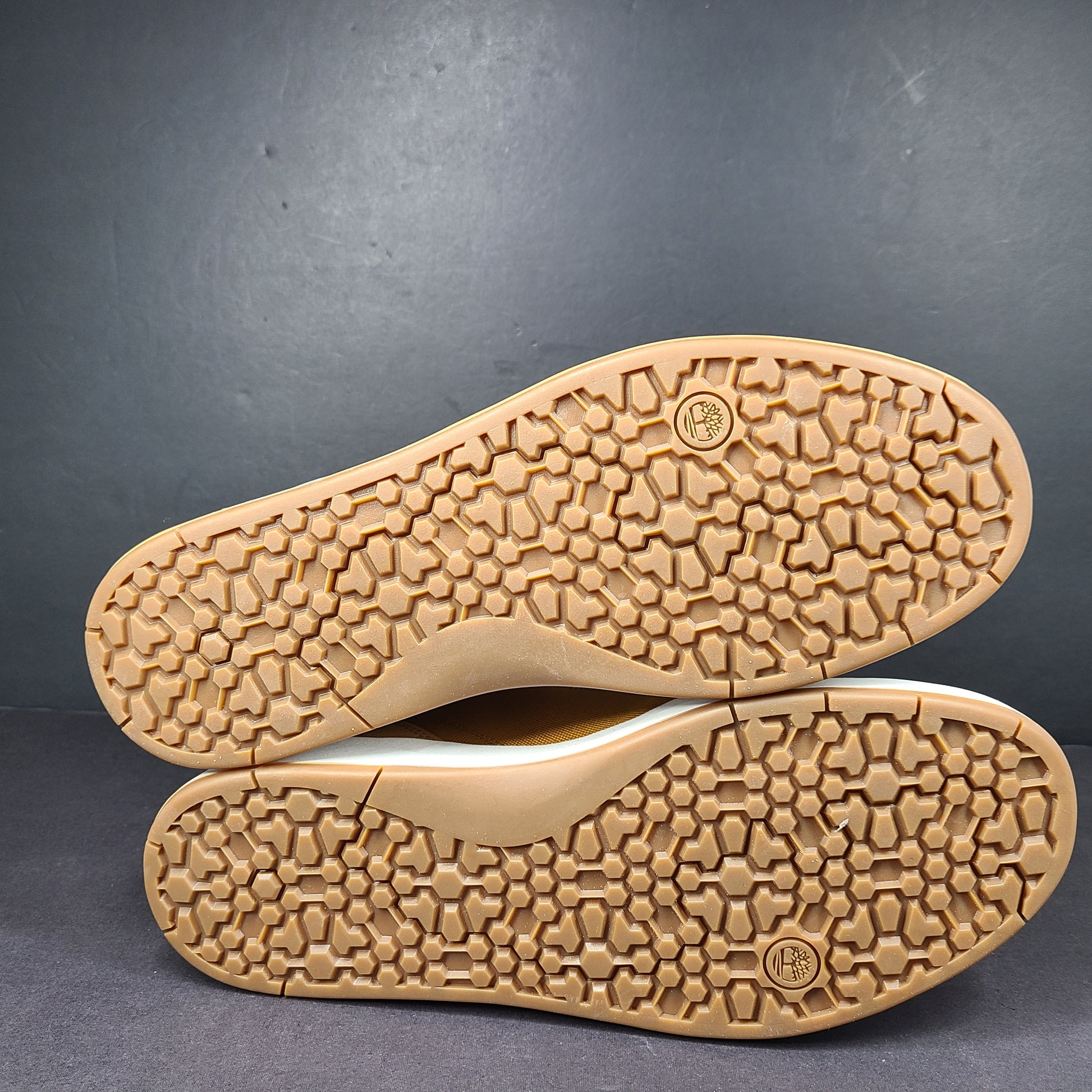 A pair of Timberland men’s sneakers in yellow and brown color.