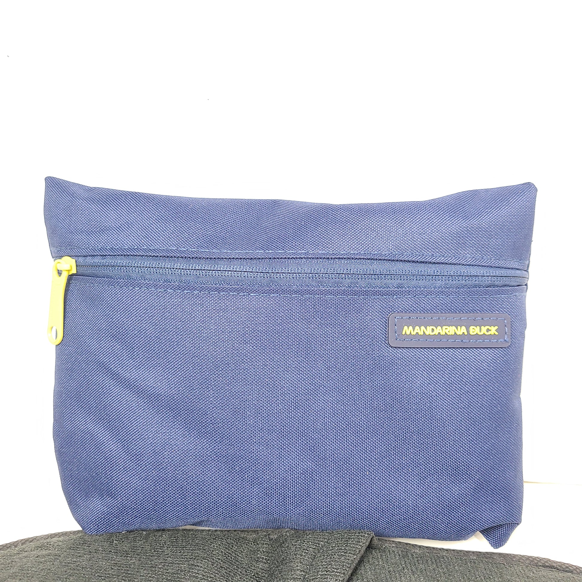Sleek blue-gray Mandarina Duck Turkish Airlines travel kit pouch with socks, slippers, eye mask and an extra bag for compact organization.