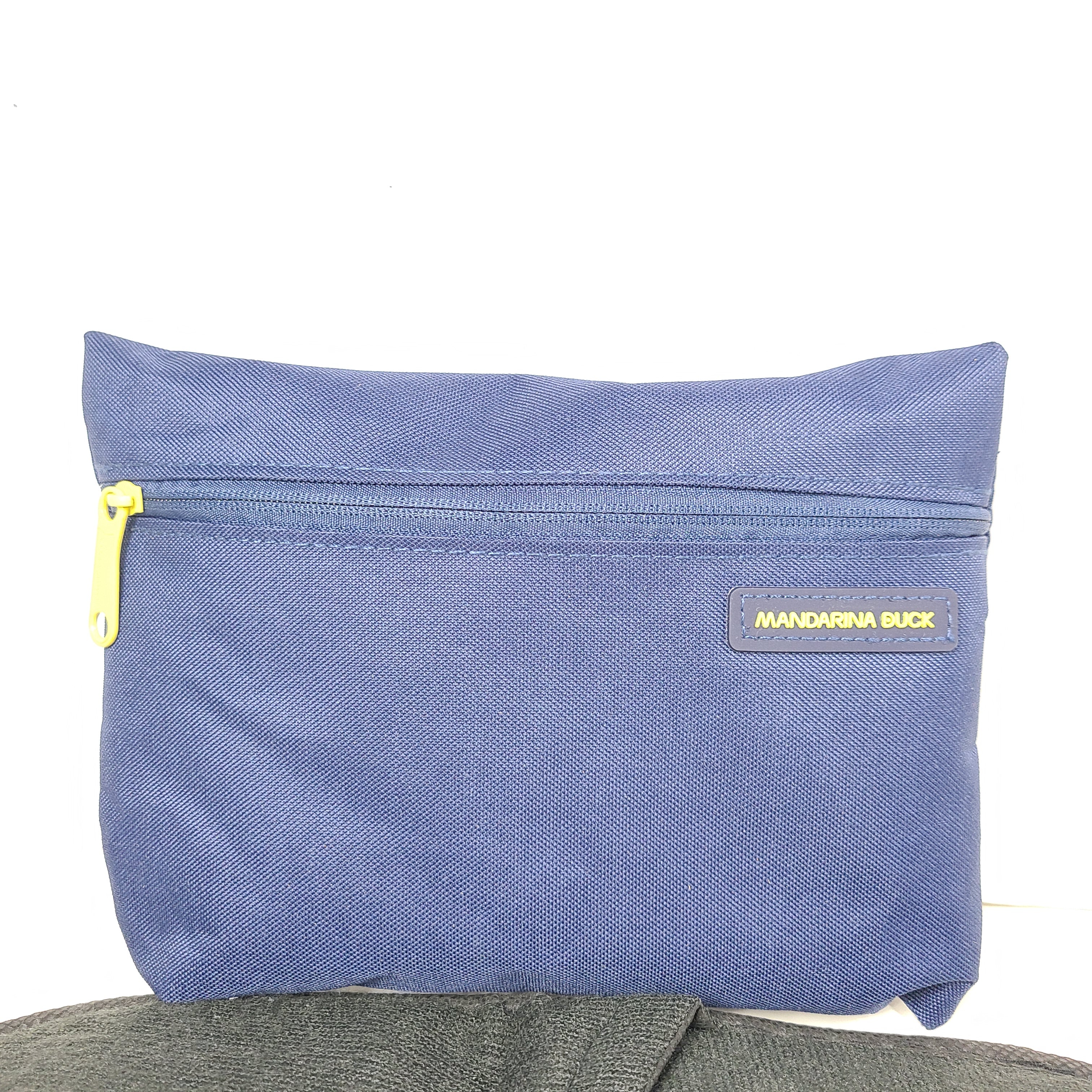 Sleek blue-gray Mandarina Duck Turkish Airlines travel kit pouch with socks, slippers, eye mask and an extra bag for compact organization.