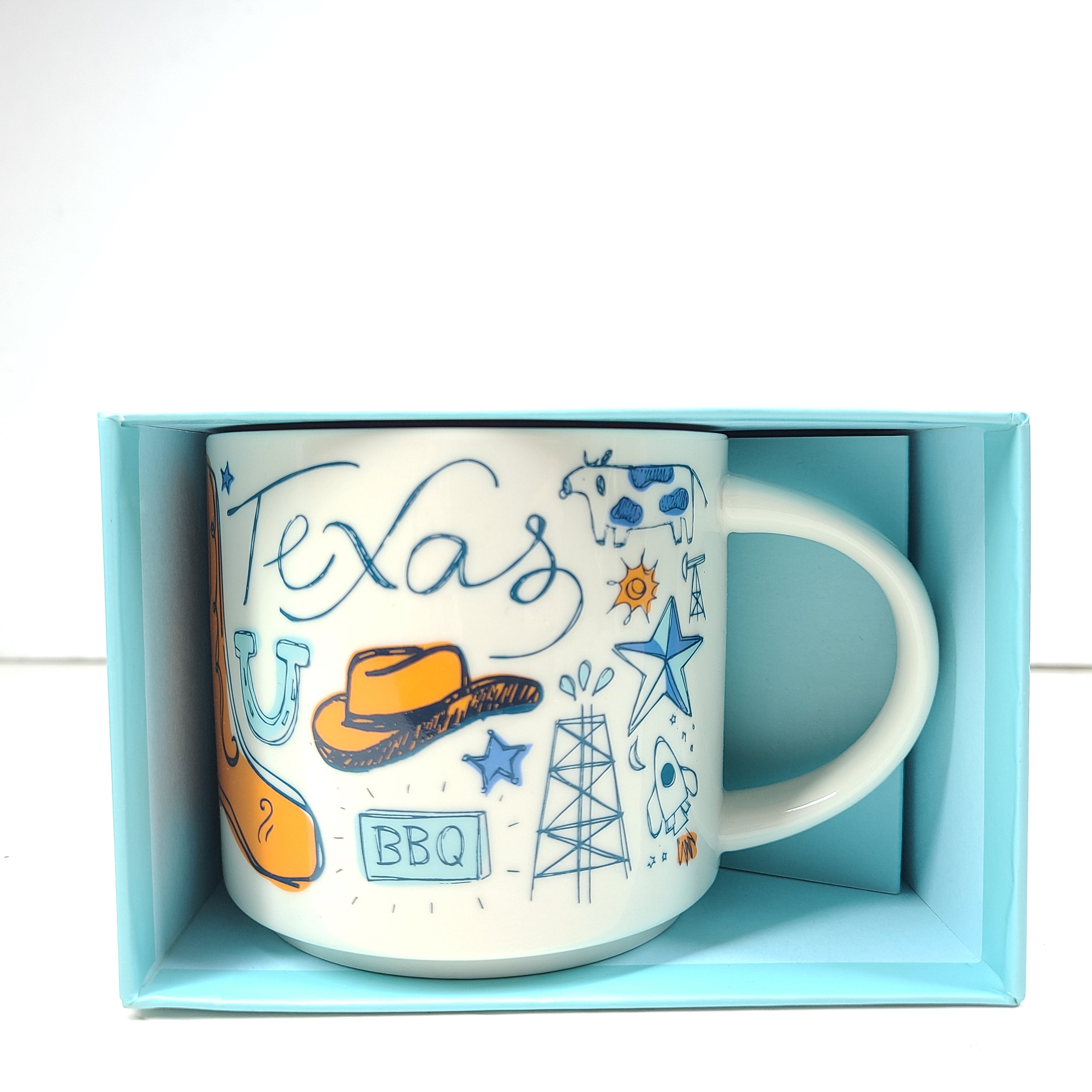 Starbucks Been There Series Texas mug with white base, blue and orange graphics and a comfortable handle for everyday use.