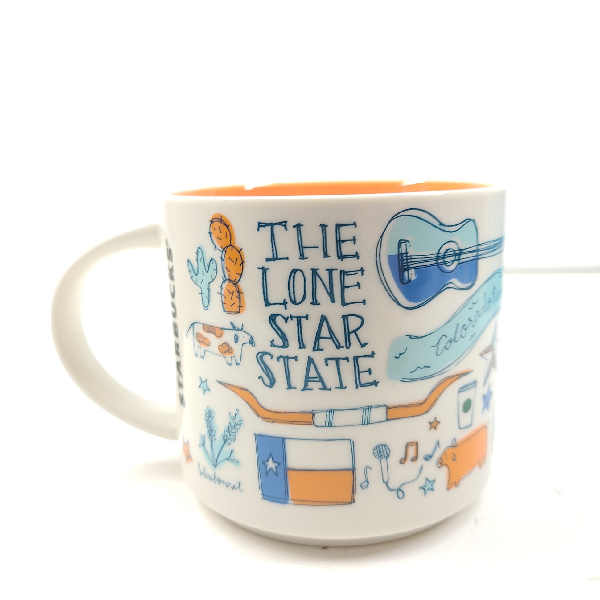 Starbucks Been There Series Texas mug with white base, blue and orange graphics and a comfortable handle for everyday use.