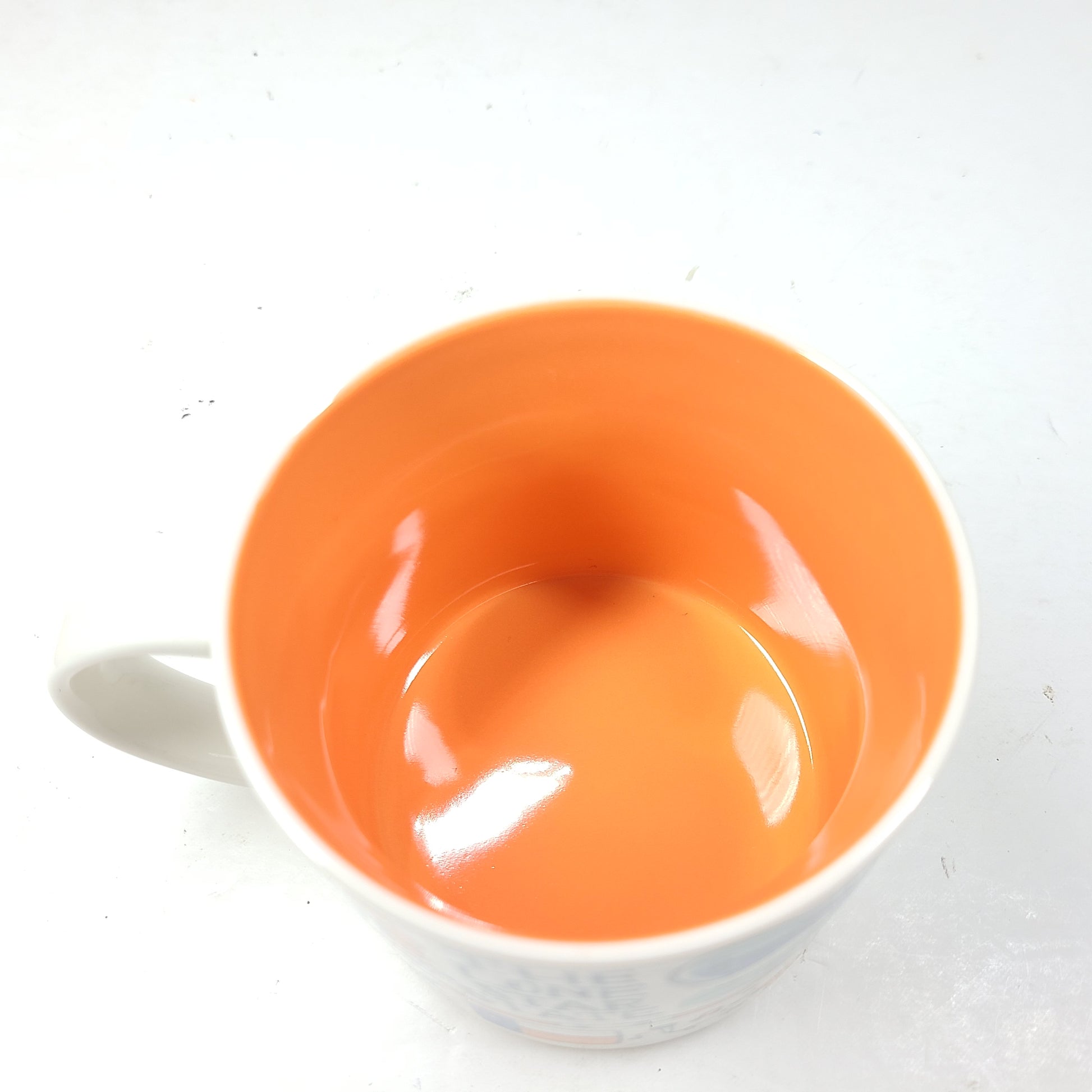 Starbucks Been There Series Texas mug with white base, blue and orange graphics and a comfortable handle for everyday use.