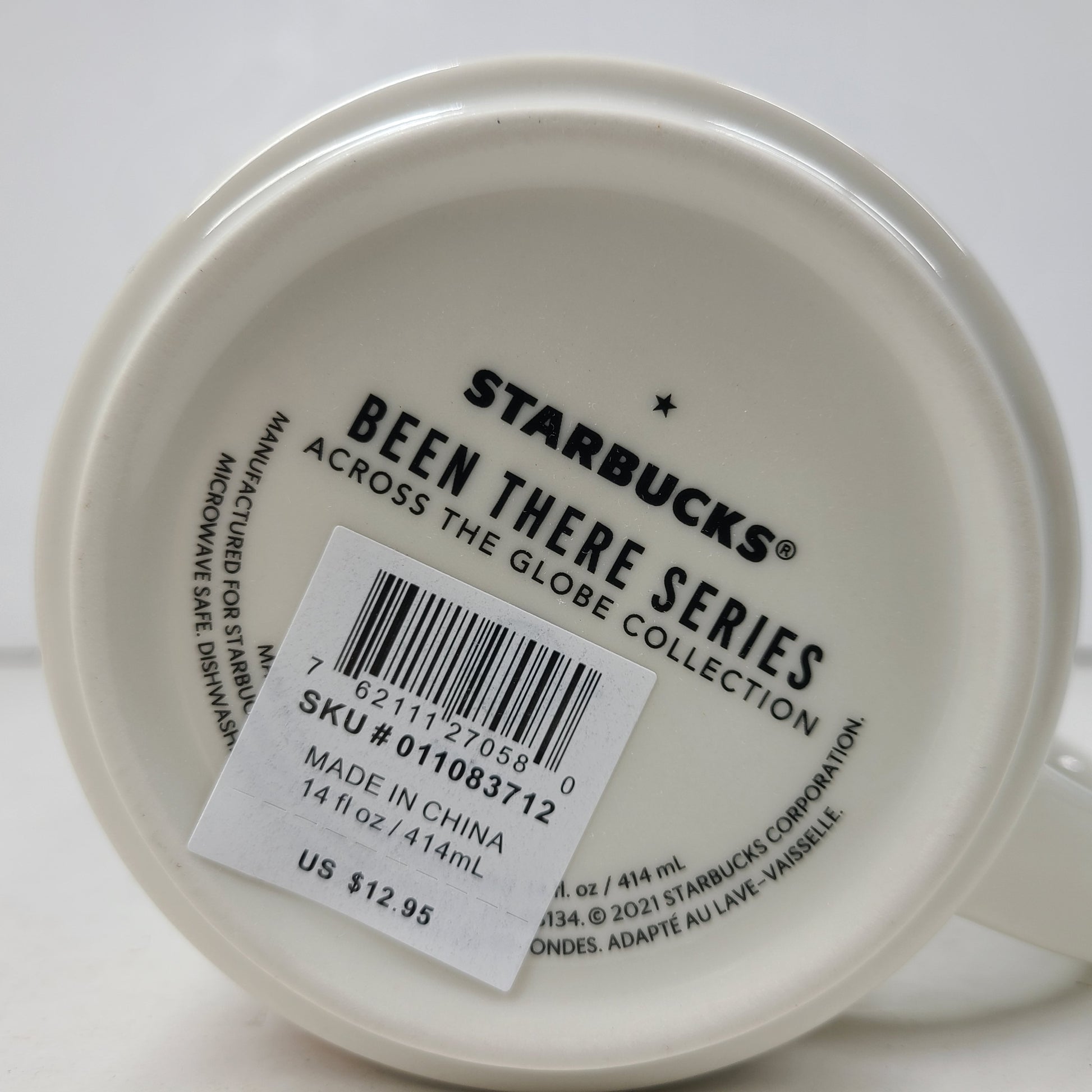 Starbucks Been There Series Texas mug with white base, blue and orange graphics and a comfortable handle for everyday use.