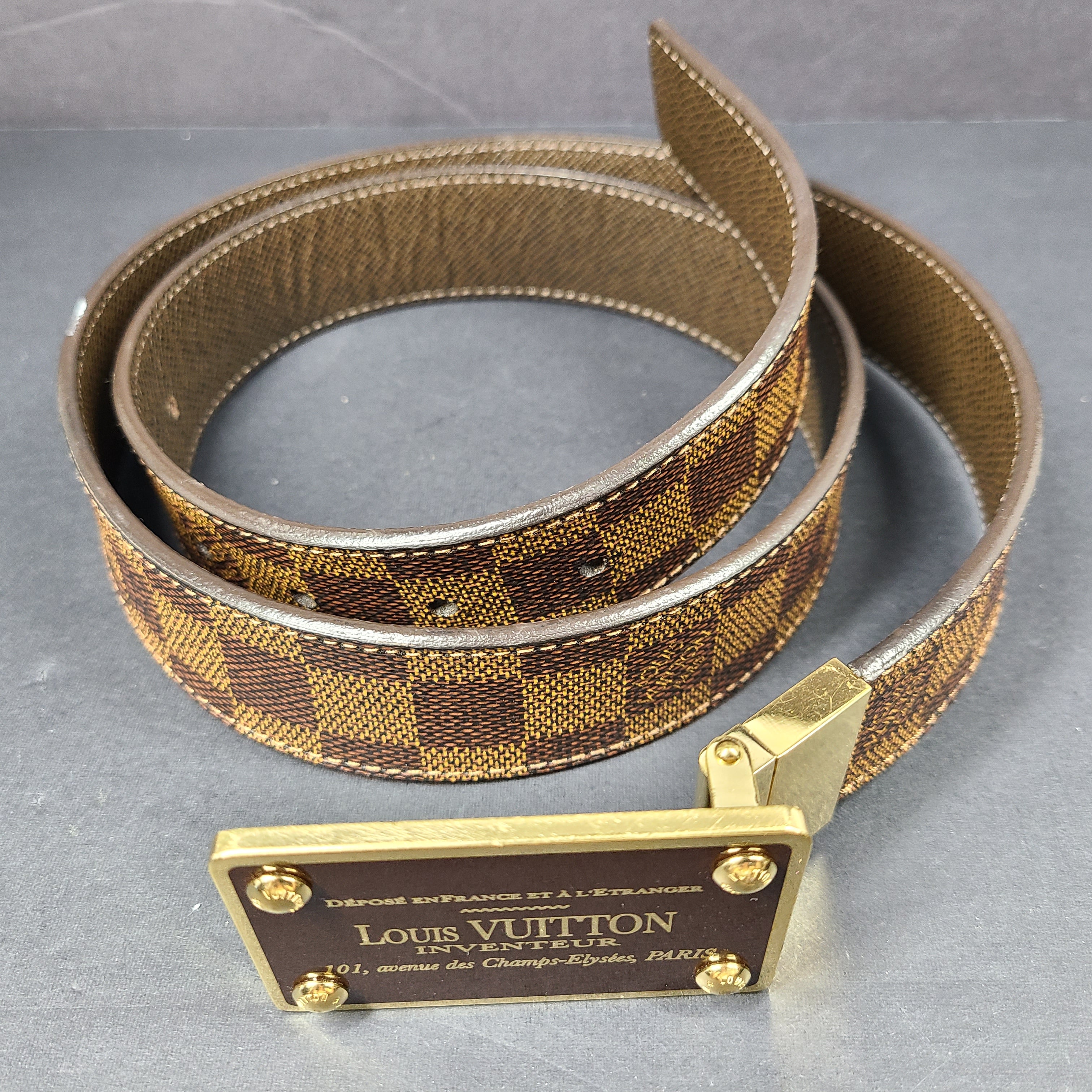 Louis Vuitton Damier canvas belt with Inventeur plaque and brown leather accents, size 95/38.