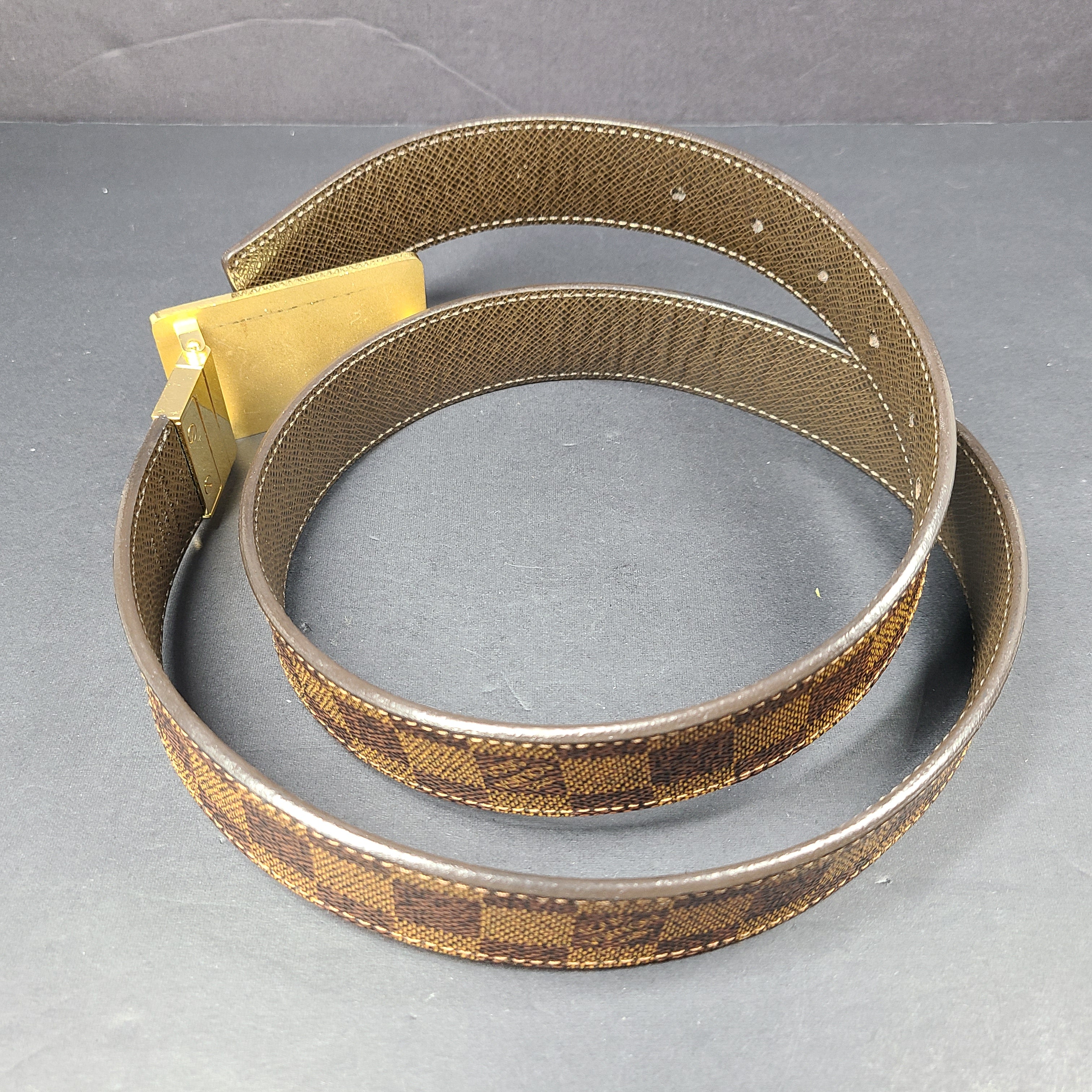 Louis Vuitton Damier canvas belt with Inventeur plaque and brown leather accents, size 95/38.