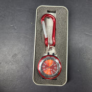 Red and silver pocket watch with a secure carabiner clip, slim profile, and durable construction for active use.