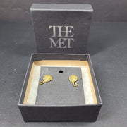 Gold Mediterranean coin stud earrings with secure posts and a timeless classical motif for everyday and evening wear.