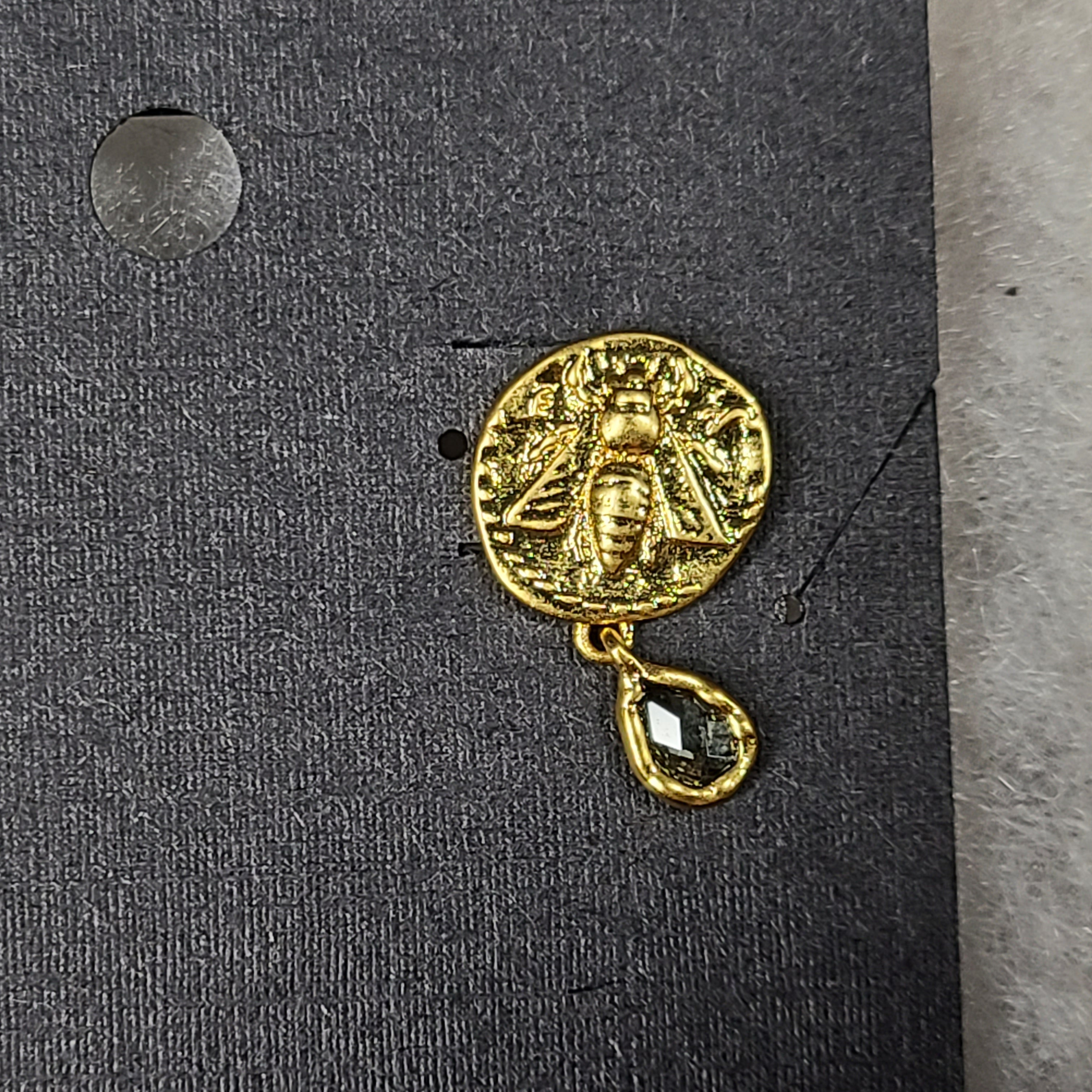 Gold Mediterranean coin stud earrings with secure posts and a timeless classical motif for everyday and evening wear.
