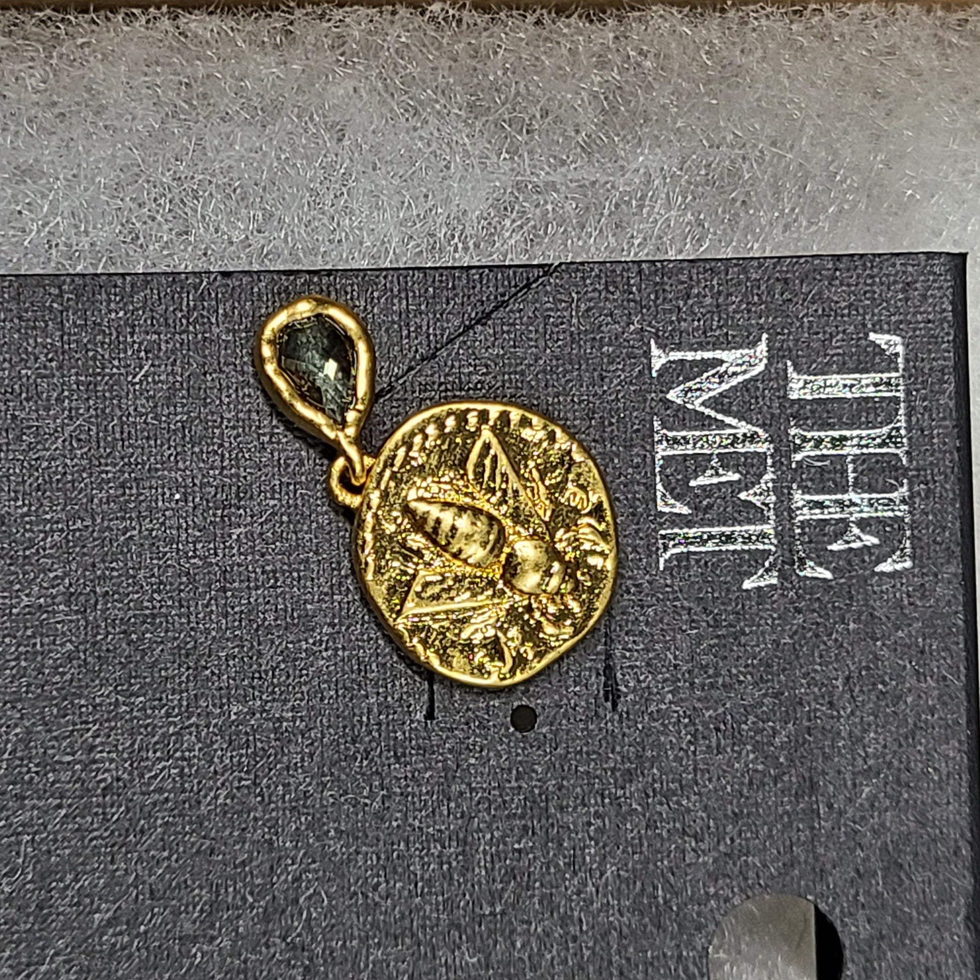 Gold Mediterranean coin stud earrings with secure posts and a timeless classical motif for everyday and evening wear.