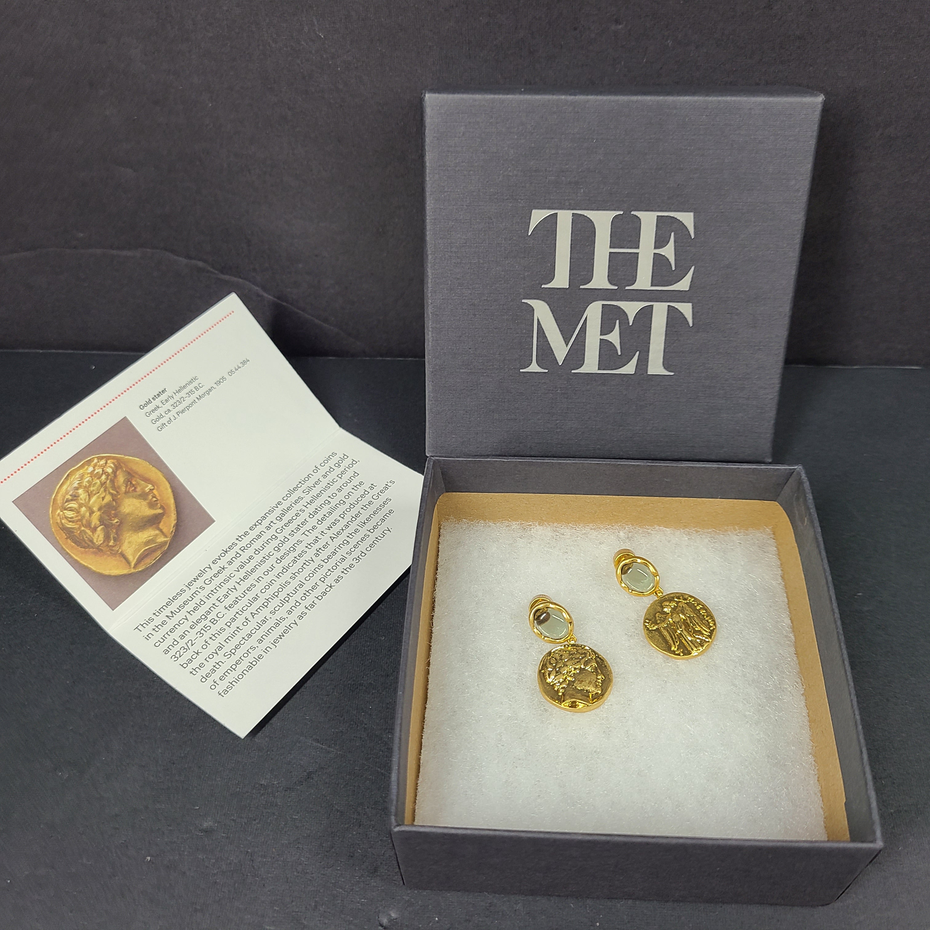 Gold coin-style drop earrings with a Greek Early Hellenistic stater-inspired design and polished finish.
